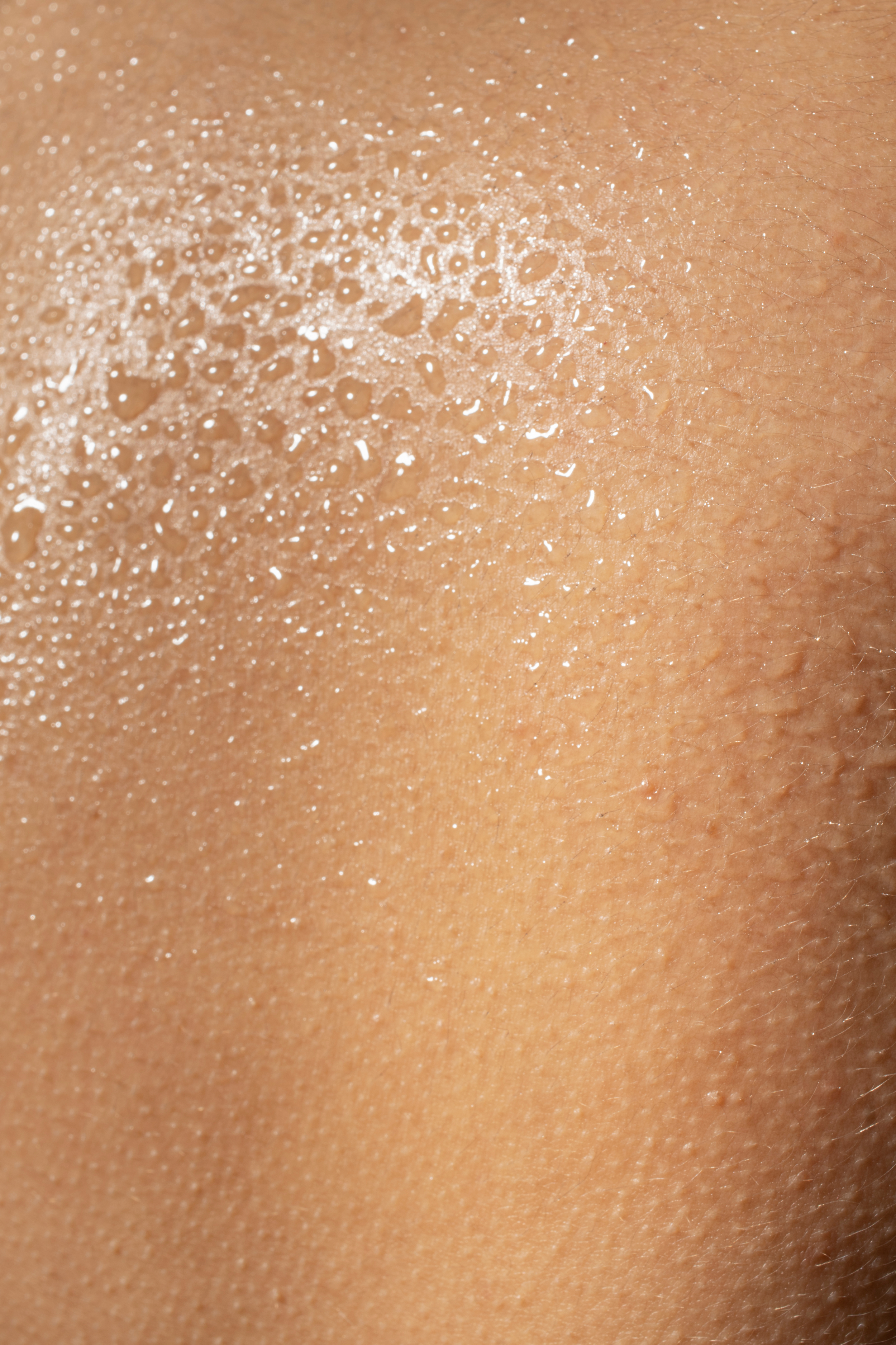 close-up-hydrated-skin-texture-with-water-drops 1.png