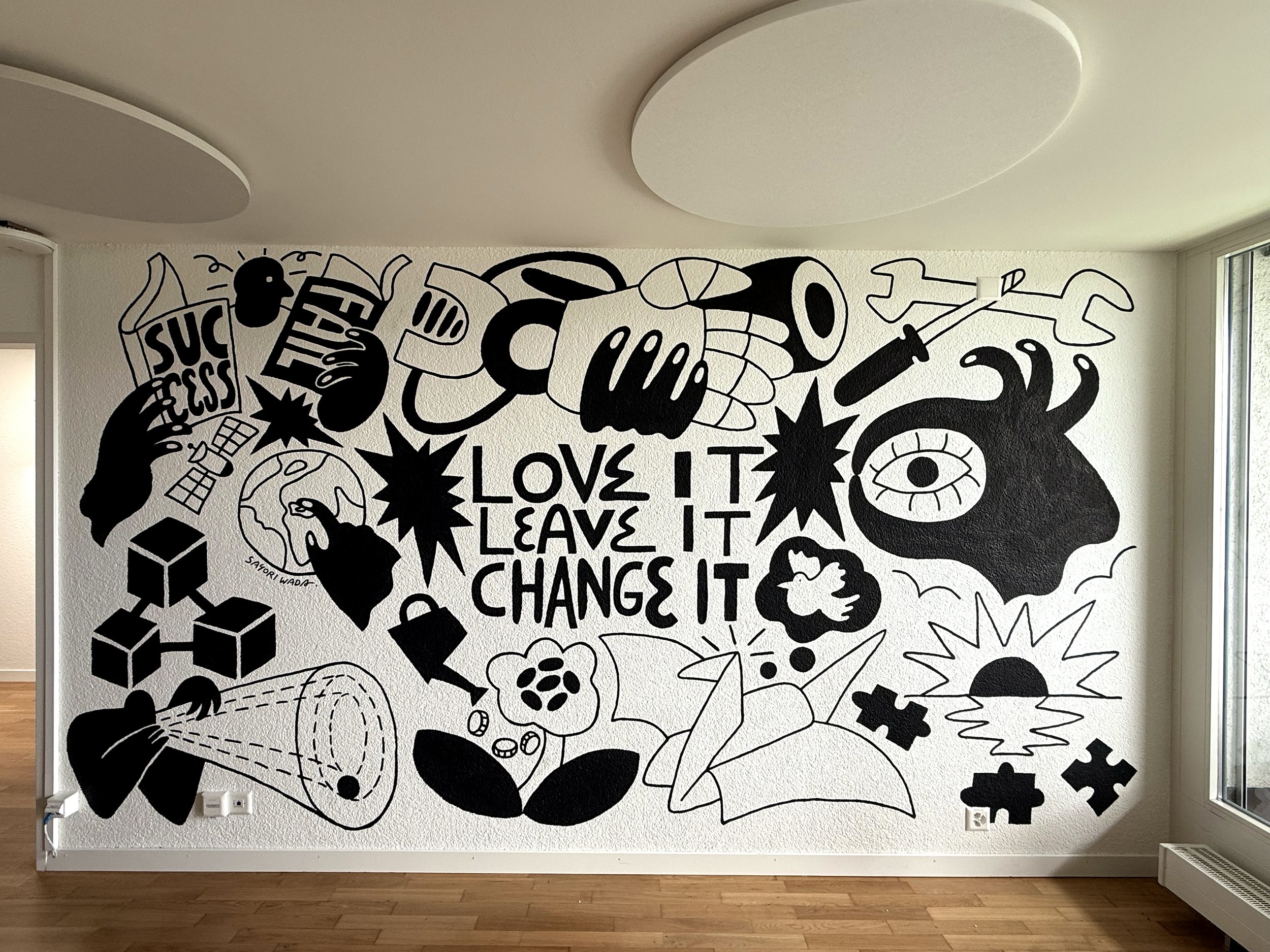 Office wall mural created by Tokyo-born freelance illustrator Sayori Wada in Zurich, featuring bold colors and graphic design elements