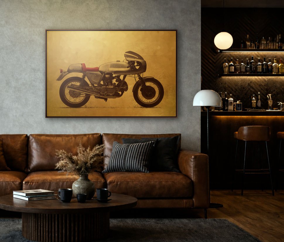 Living room with a brown leather sofa, a round wooden coffee table, a large framed bike artwork on the wall, and a bar area with bottles and glasses in the background.