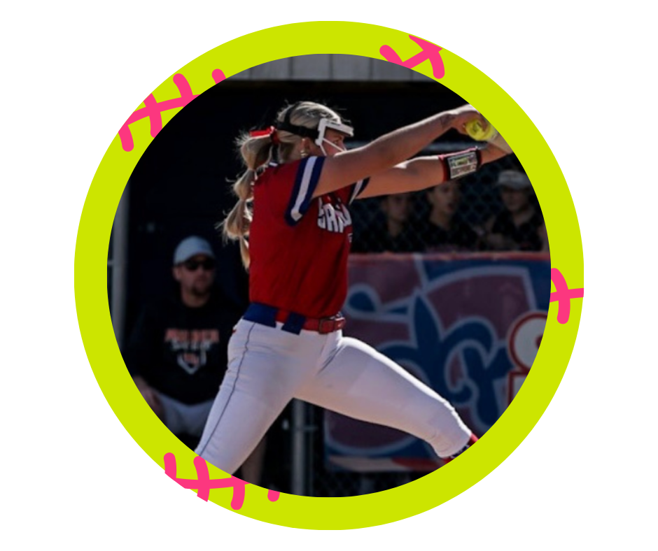 A female softball player in a red and white uniform preparing to catch a ball.