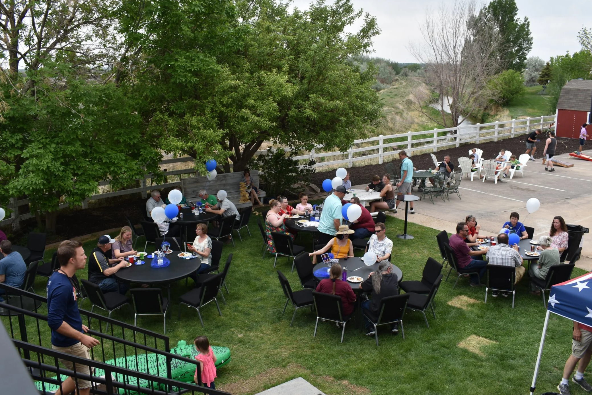 Graduation Party - guest seating with room for a cornhole tournament in the closed-off parking area.