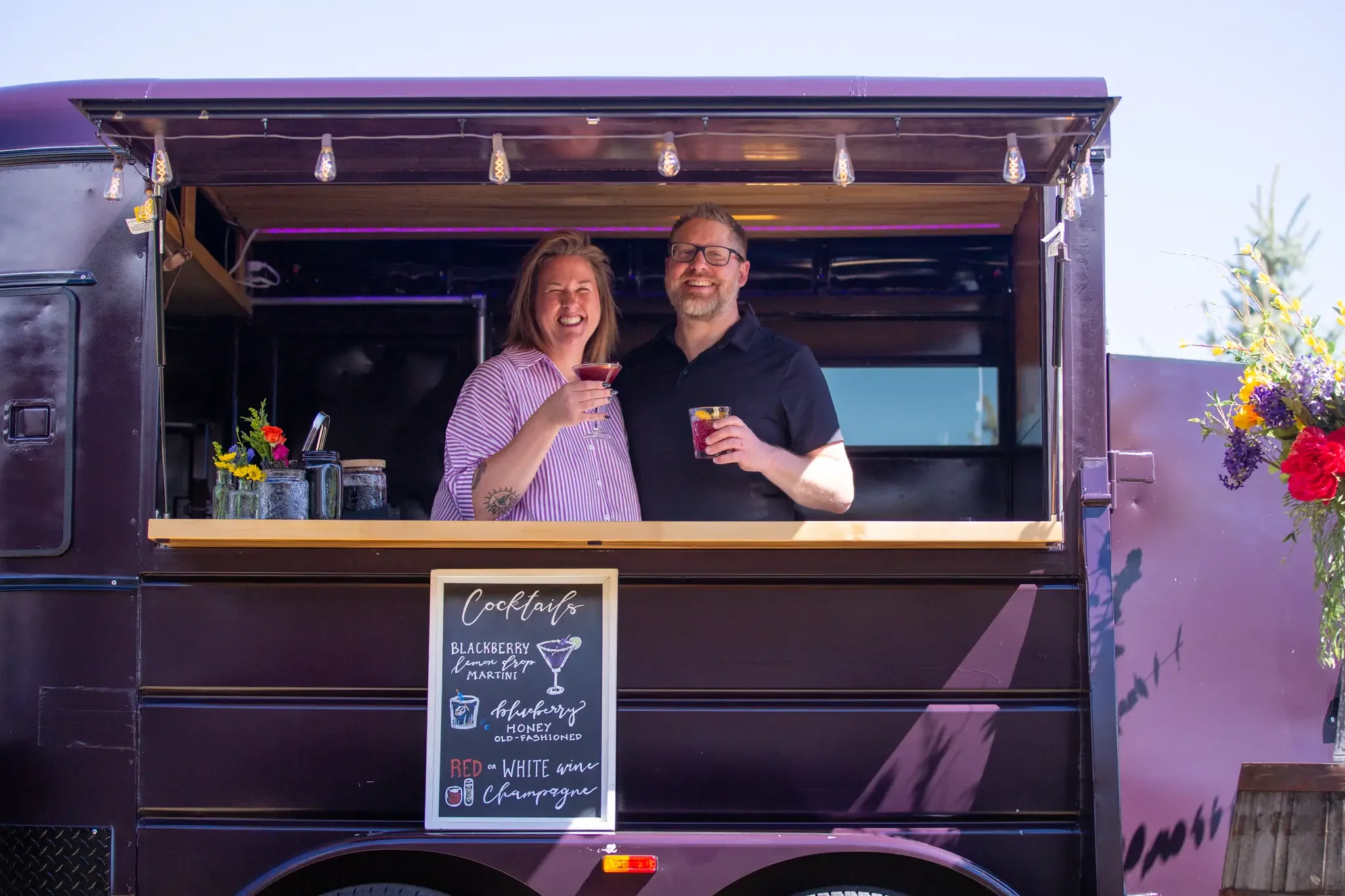 PortablePour_owners toast in trailer.webp