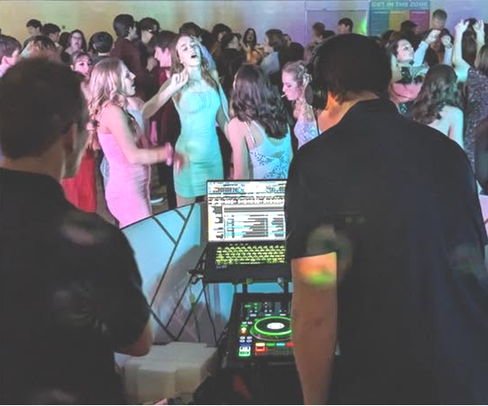 MES_DJ stand with crowd.png