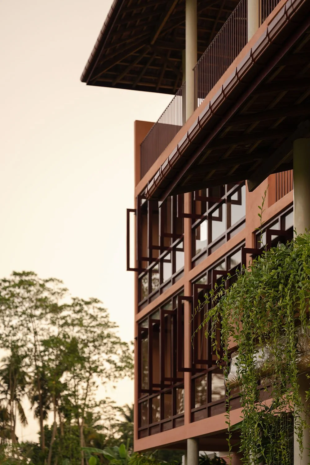 Modern building with wooden balconies and open window panels — Casa Tikiri Paddy Lodge, Ahangama, Sri Lanka