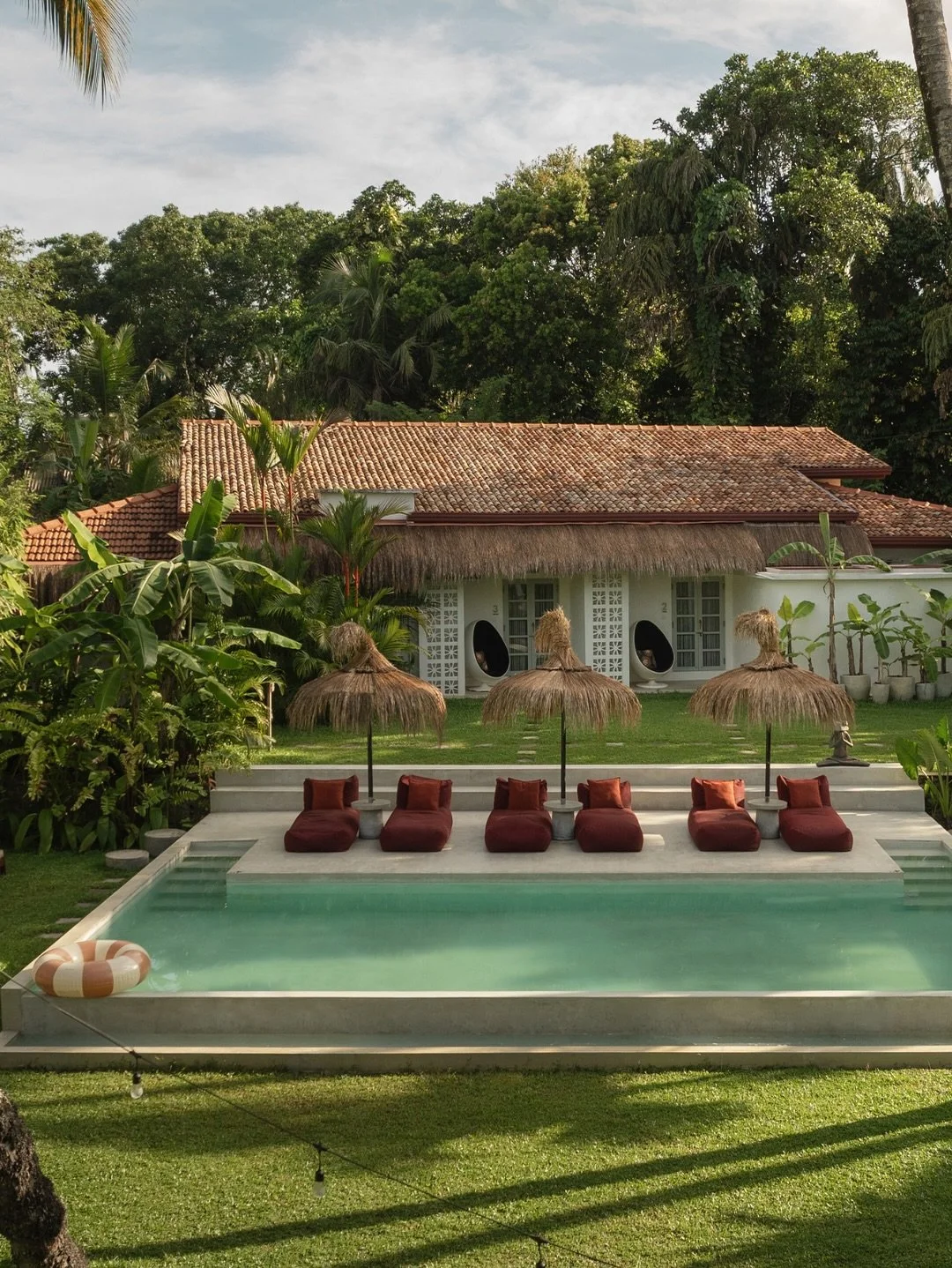 Where does the garden end and the jungle begin? 🌴

Surrounded by towering palms, daybeds, and a pool that feels suspended in green &ndash; this is our little corner of paradise.

If you could be here right now&hellip; would you go for a swim or a na