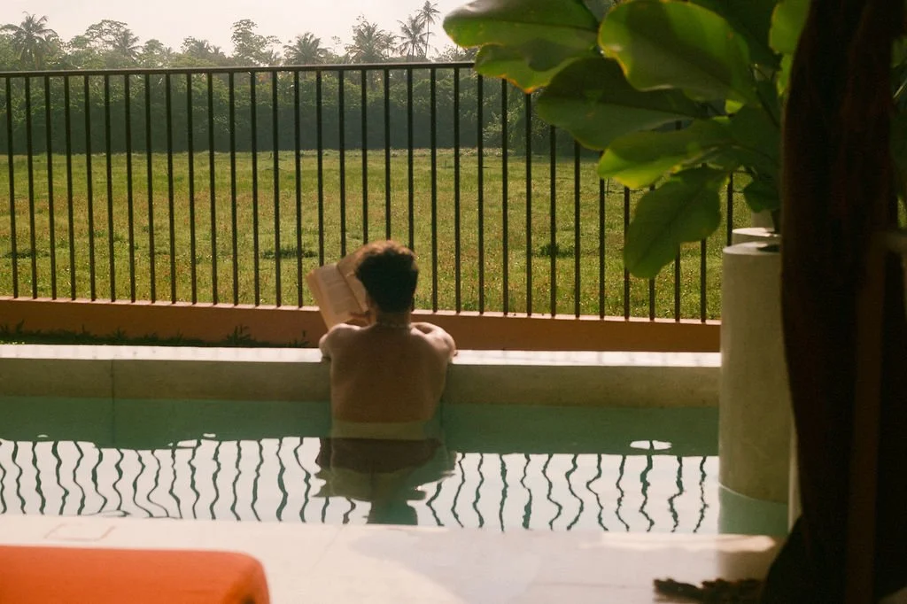 Man relaxing by the private pool at the Paddy Lodge, Casa Tikiri — Ahangama, Sri Lanka