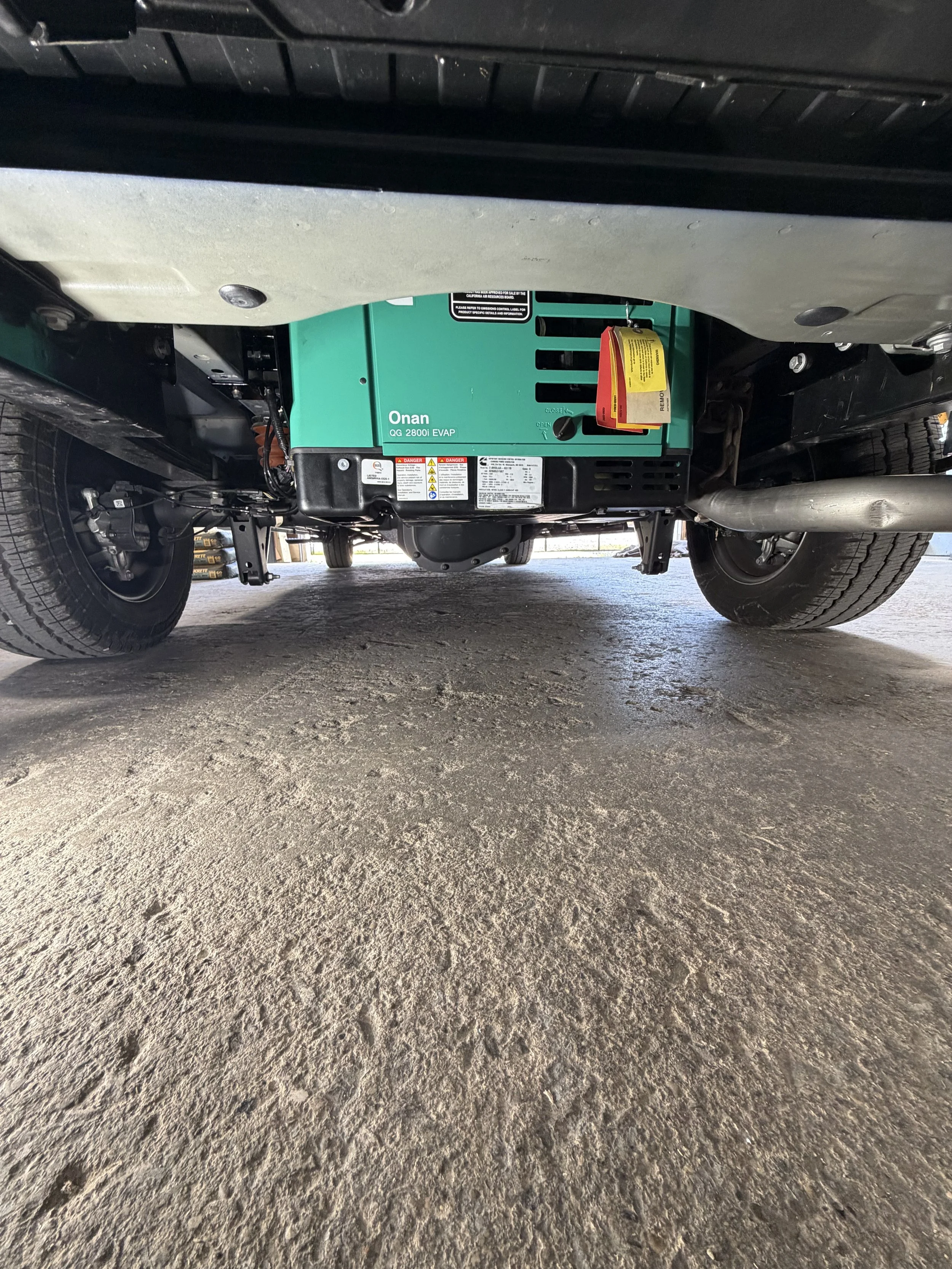 Ford Transit Generator mounted and plumbed in to power adventure van. 