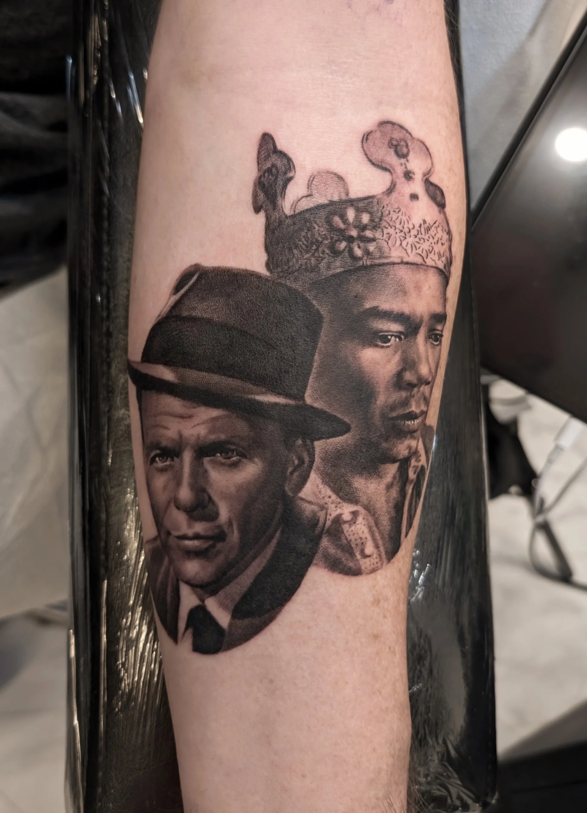 black and grey portraits of Frank Sinatra and King Tubby