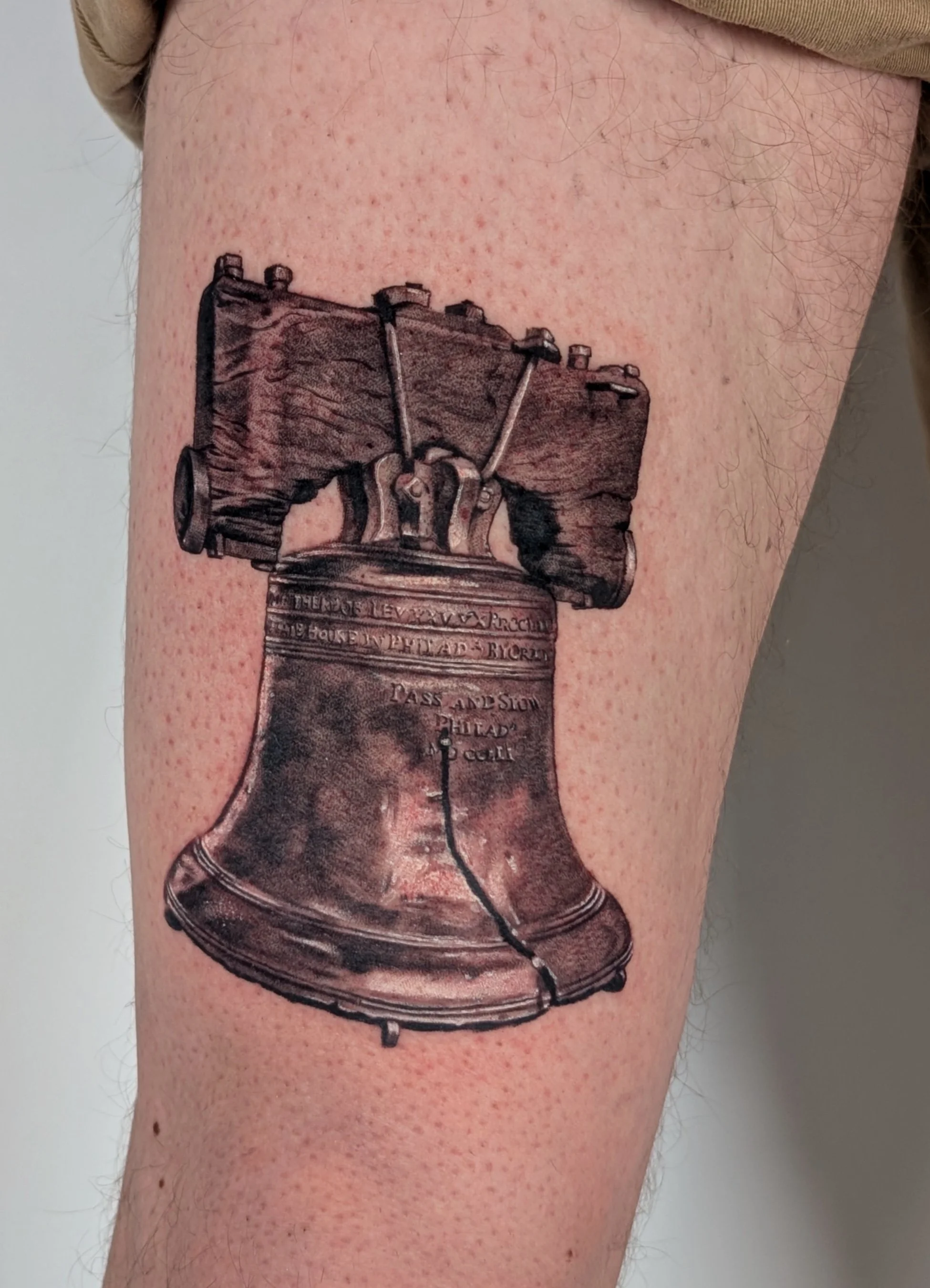 tattoo of the liberty bell done in high realism