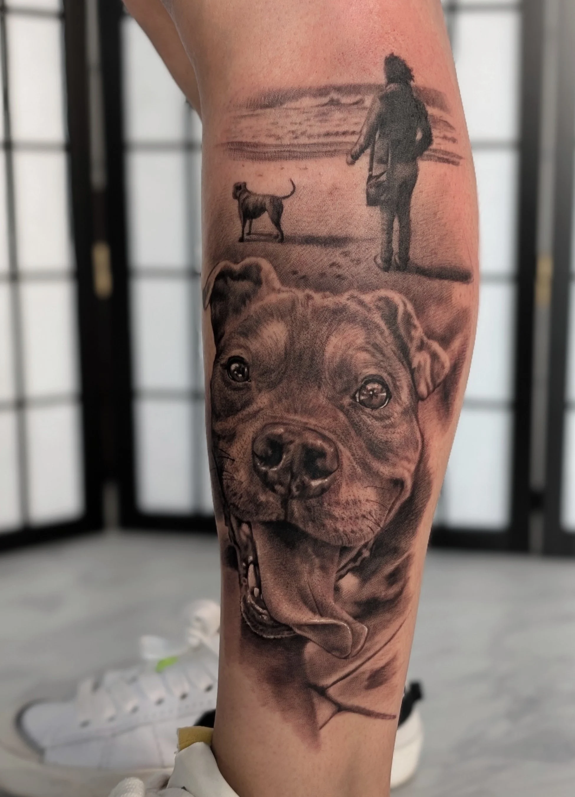 tattoo of a dog walk on the beach with a happy puppy portrait
