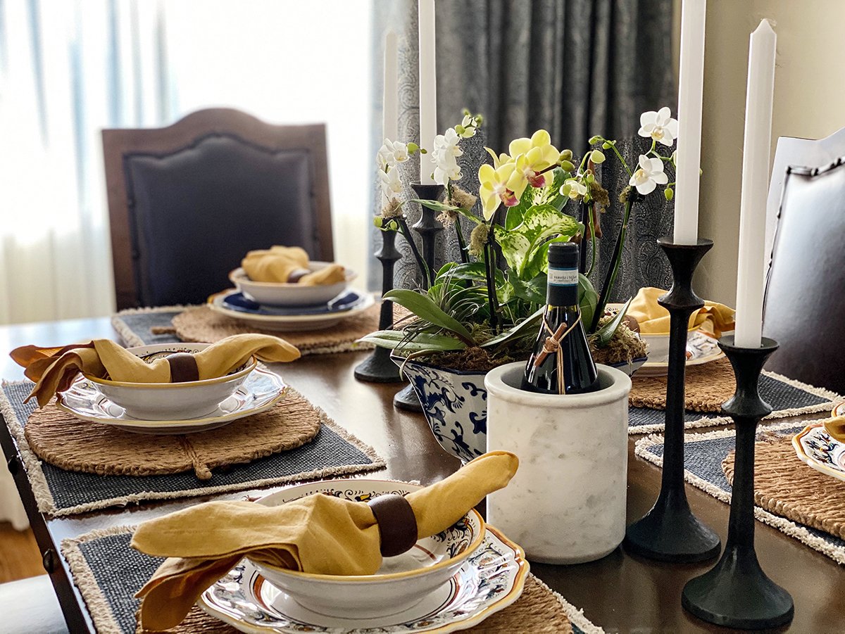 Traditional table setting with blue and yellow color scheme