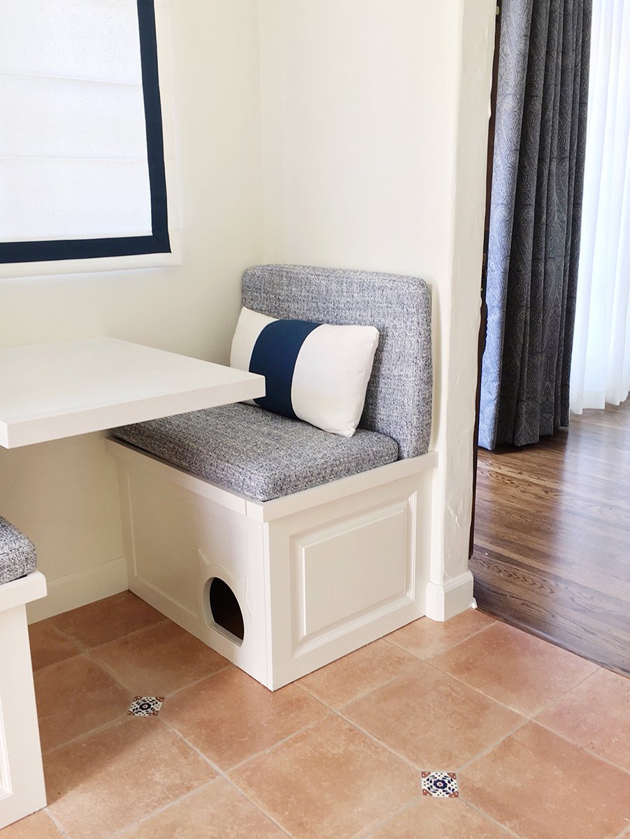 Design should always take into account the family pets. Custom built bench with storage and hidden cat nook.