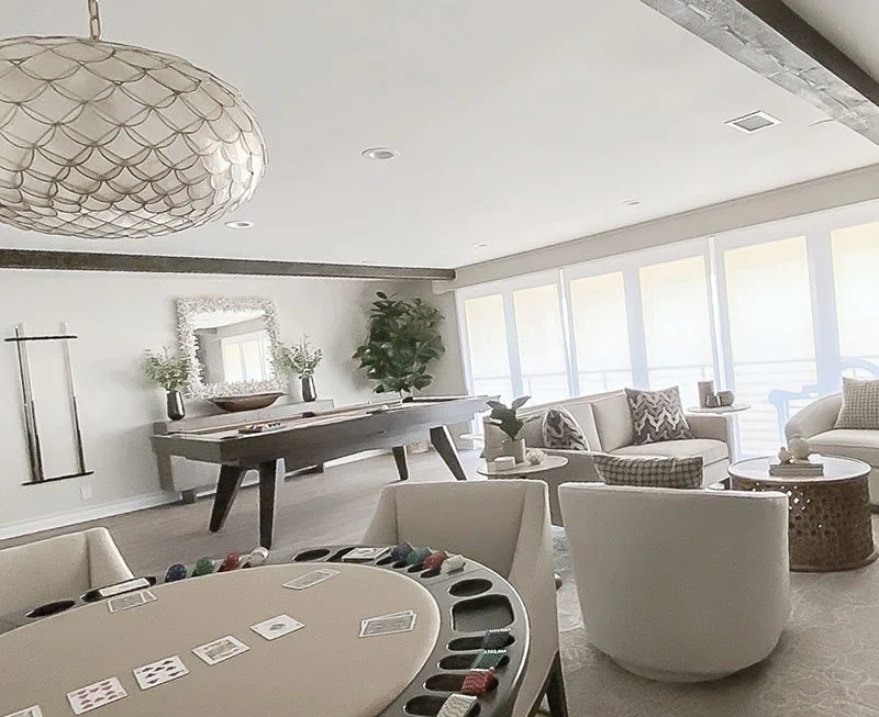 Transitional game room with pool table, neutral decor, modern lighting, and comfortable seating