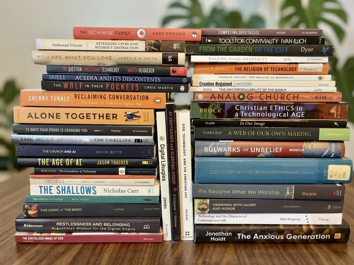technology book's on Andrew's desk