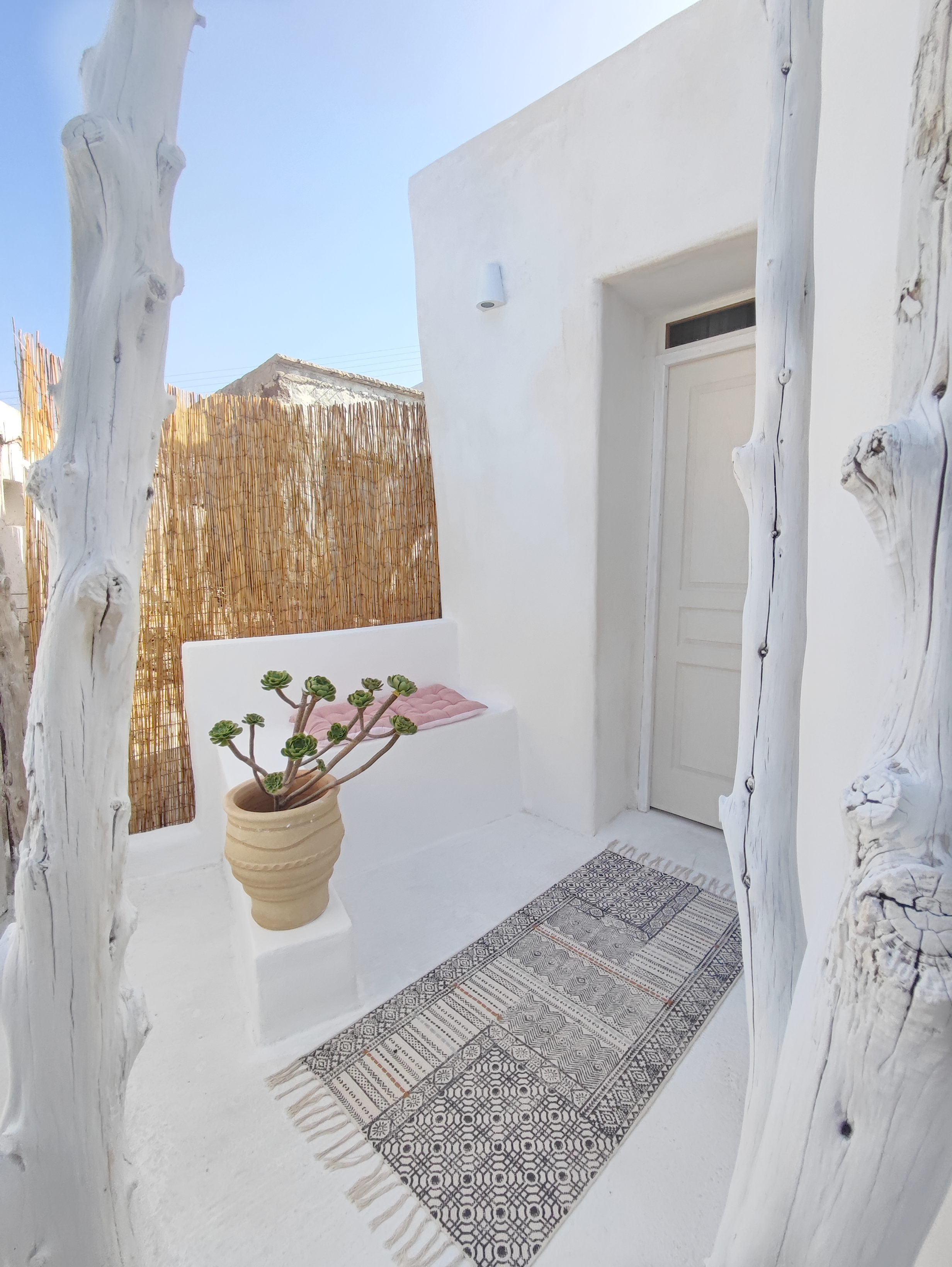 Inviting outdoor terrace of our Milos cave suite on a sunny day.