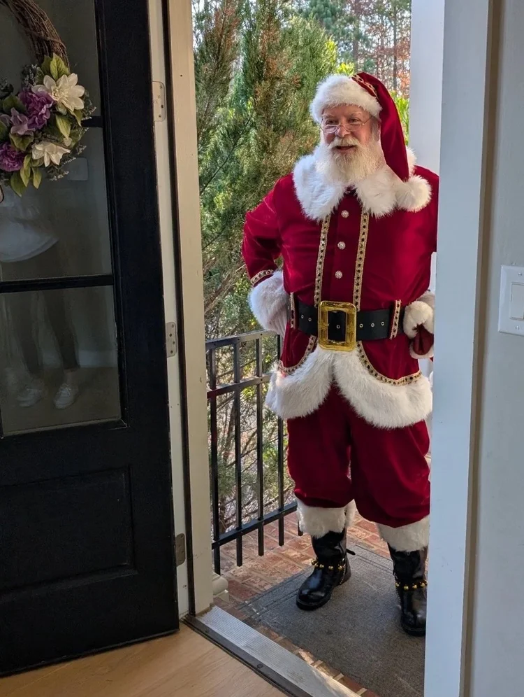 Santa arriving at a family's front door
