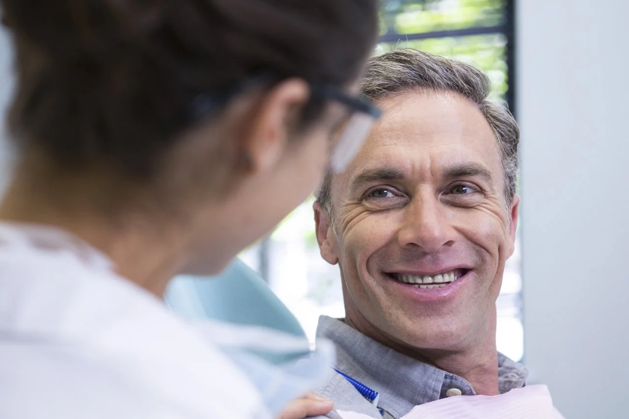 Smiling patient after dental treatments