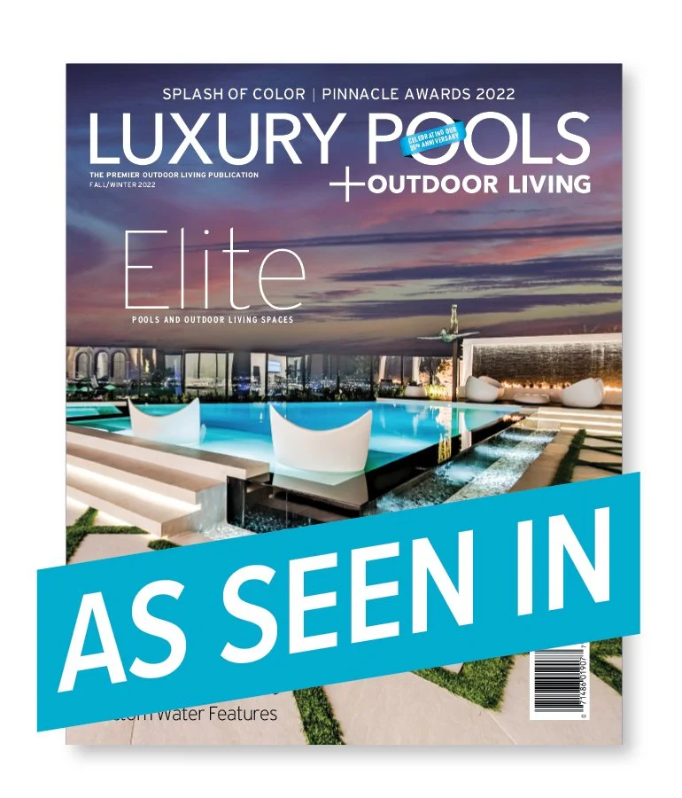 Magazine cover titled 'Luxury Pools + Outdoor Living' featuring a modern outdoor pool area with a sunset sky in the background and a large blue banner across the bottom with the text 'As Seen In'.