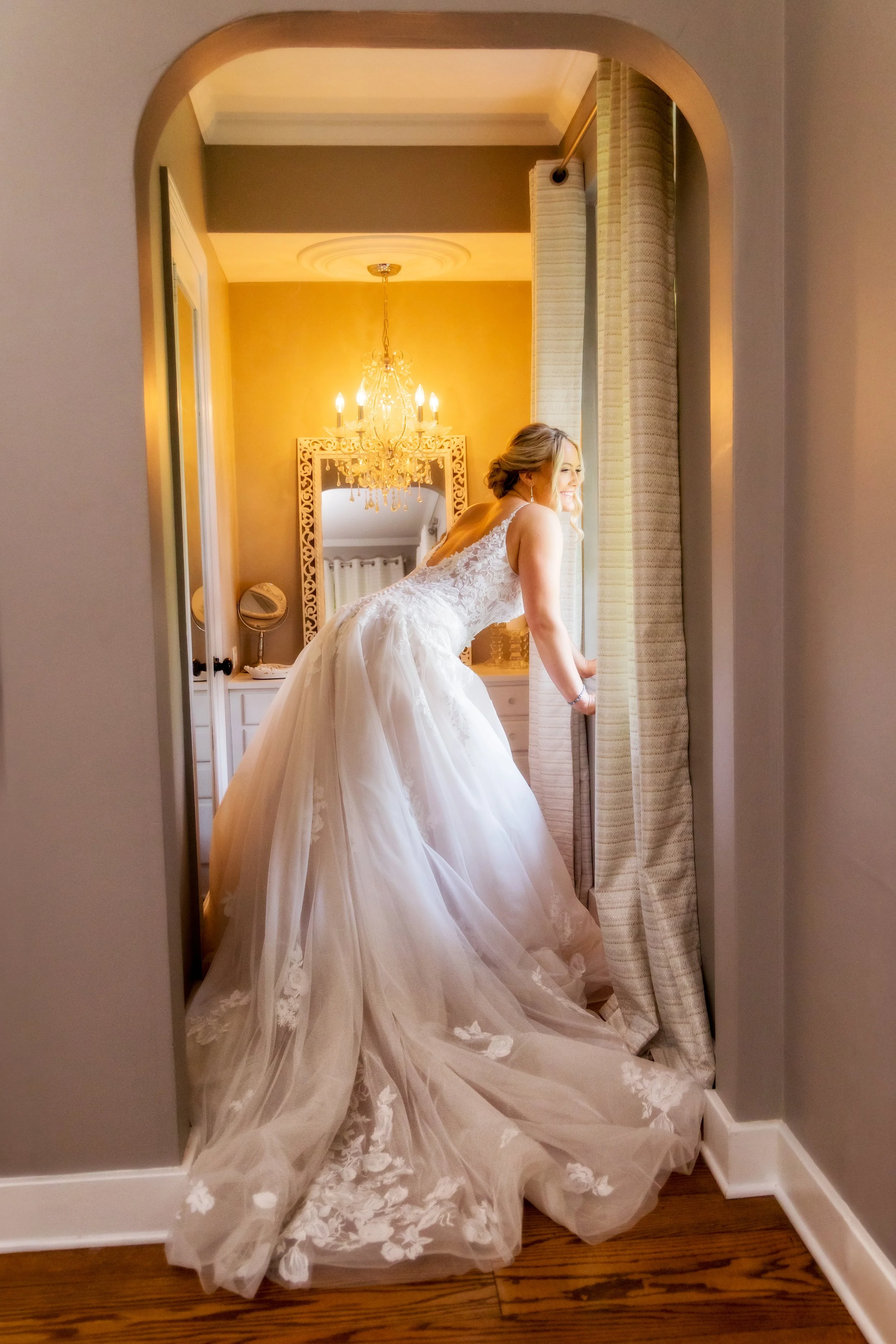 Bride looking out window