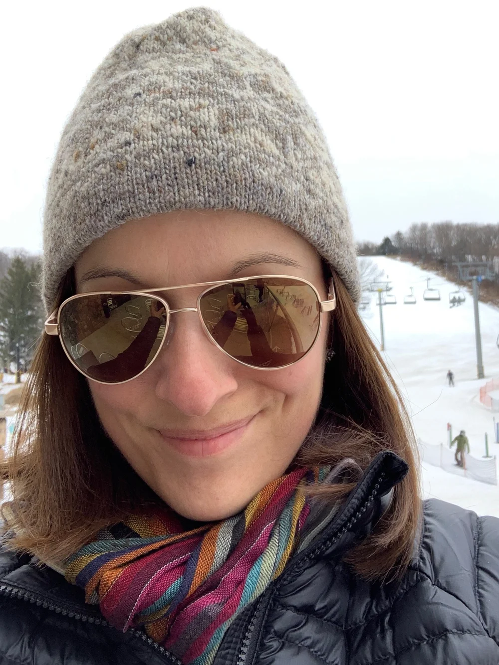 Mom takes in the Cascade Mountain action from the lodge deck