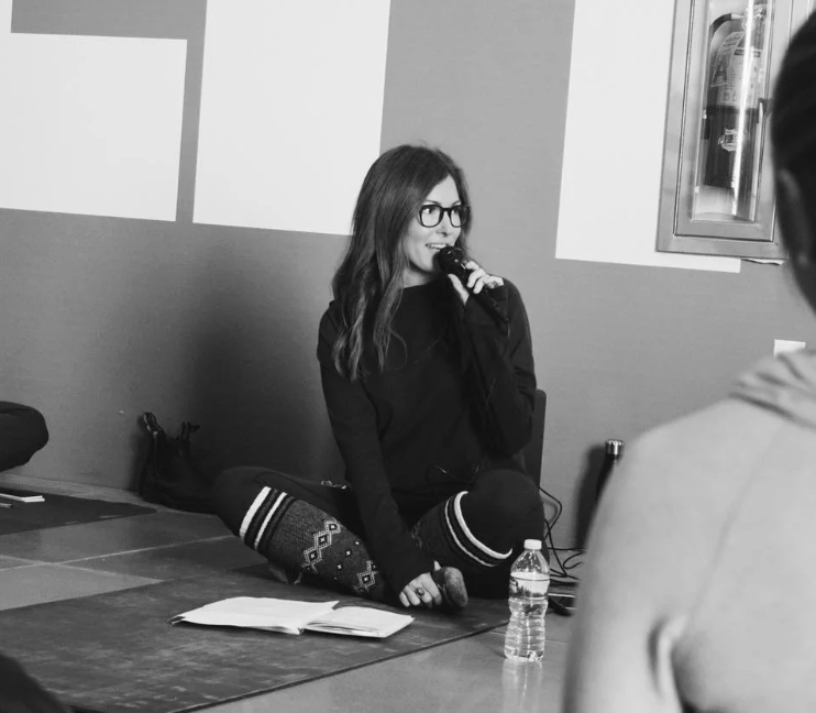 Jessica Elefante speaking as a Lululemon ambassador at the Global Day of Wellness event at the Mandarin Oriental in New York City.