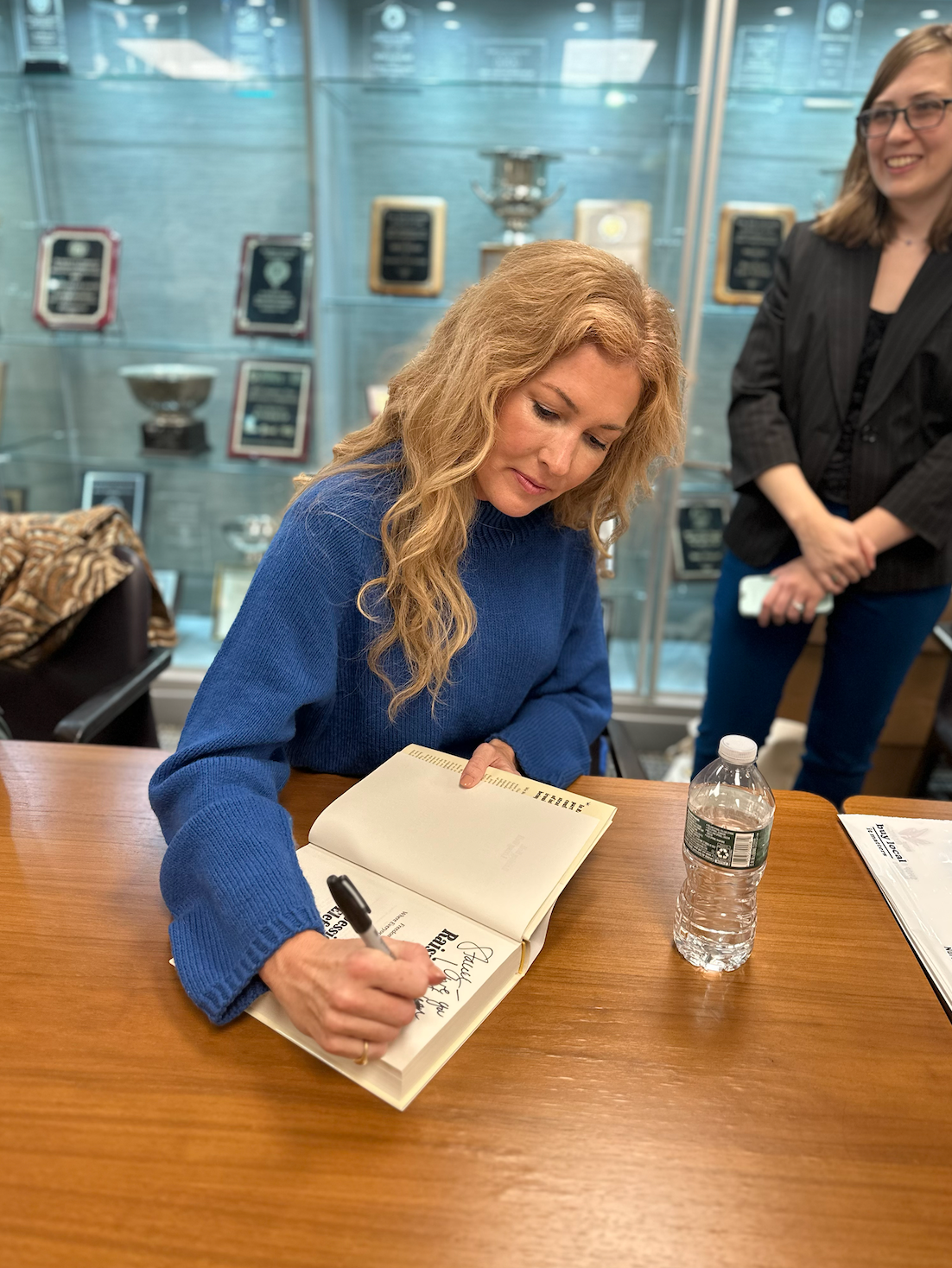 Jessica Elefante signing copies of Raising Hell, Living Well at a book event in New York City.