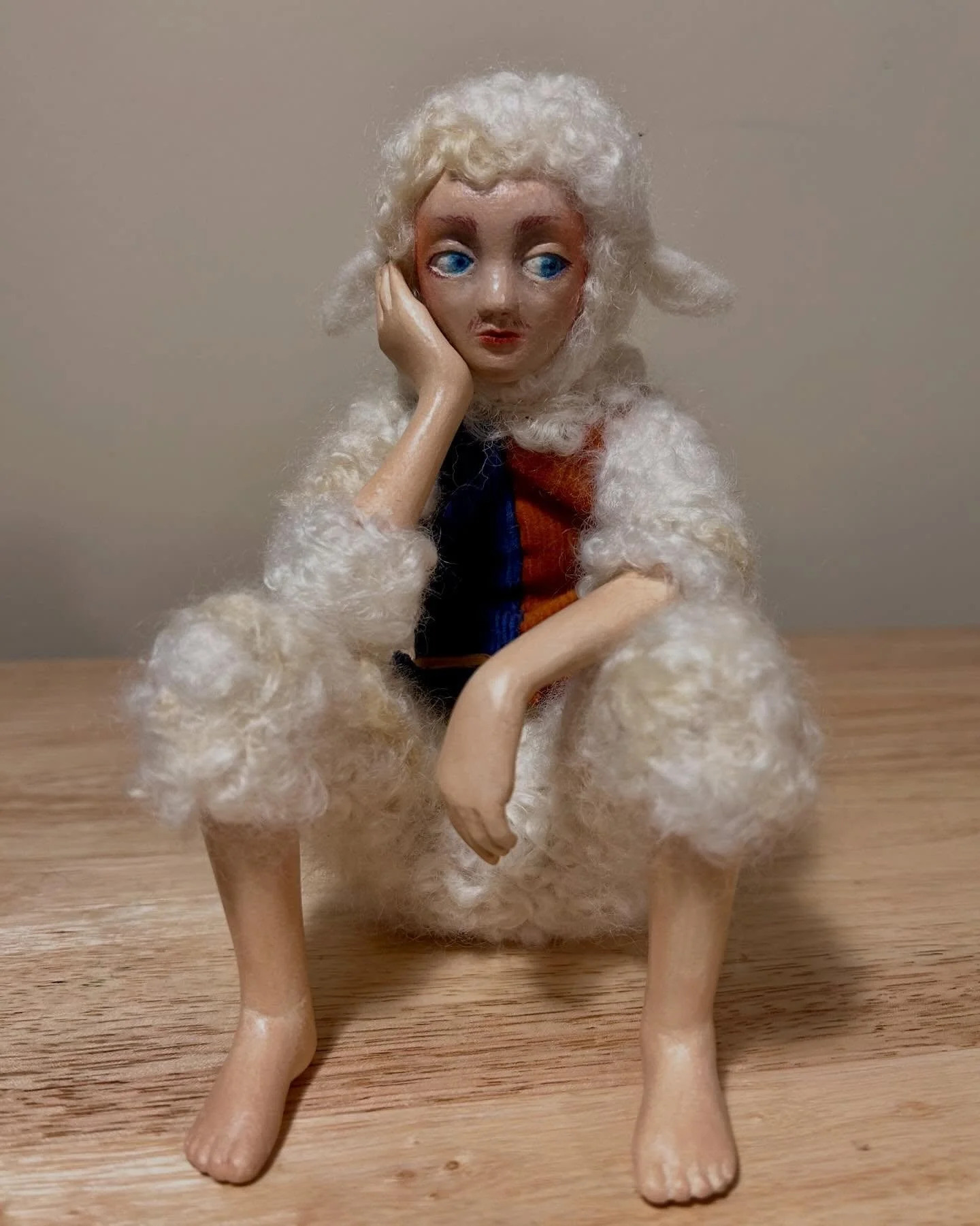 This sheep doll is the first clay-and-wool doll I made. Though the doll initiative continues to expand, its guiding principles remain the same, reflecting the journey of self-expression amidst the challenges posed by societal expectations regarding g