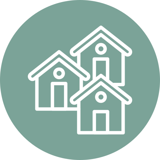 Icon of three houses with circular windows, arranged in a cluster on a green circular background.