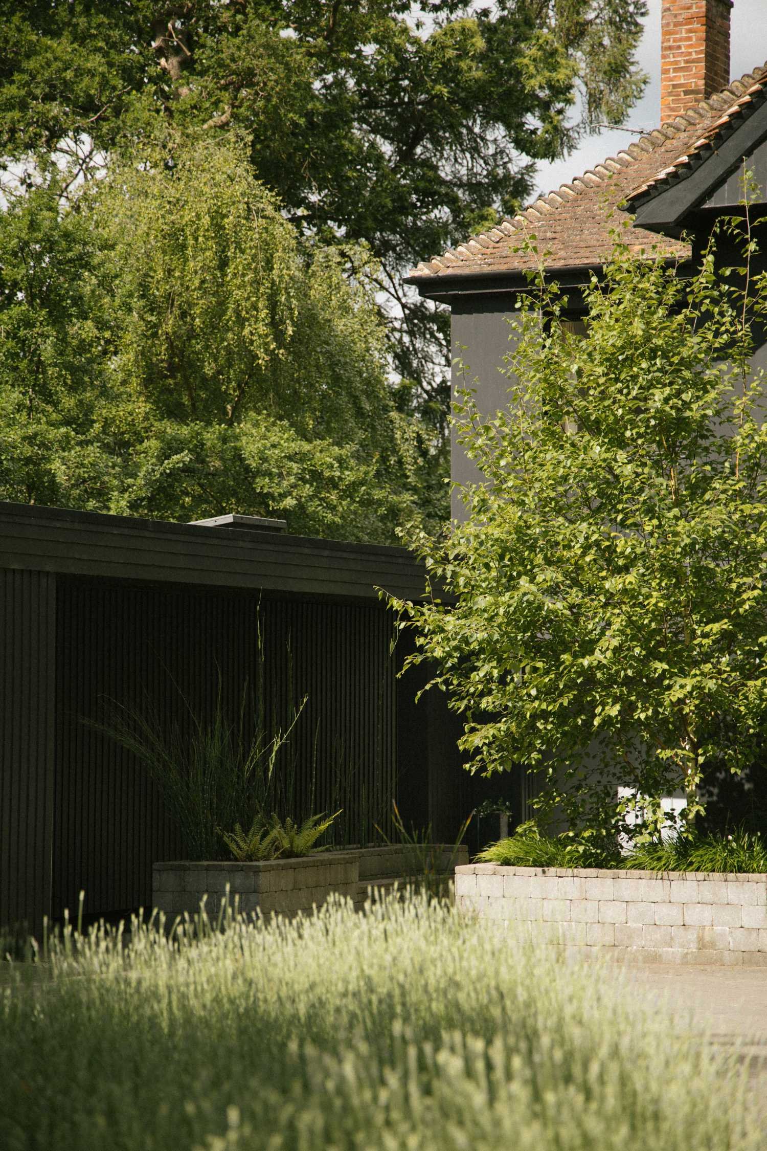 Hillcrest-house-green-belt-ottershaw-surrey-black-garage-entrance-detail.jpg