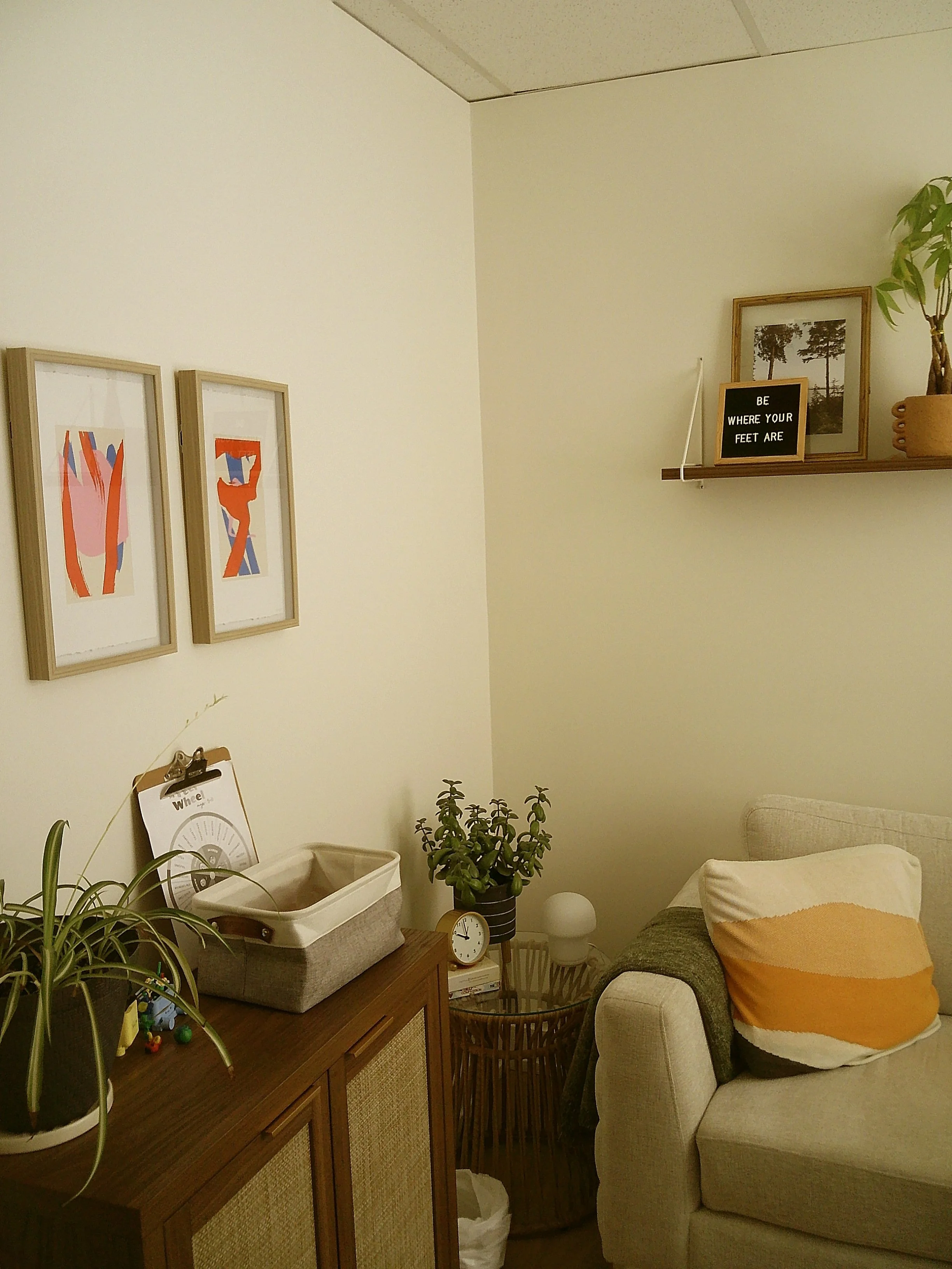 A boho Guelph therapy room with a couch and plants for ERP therapy in Ontario