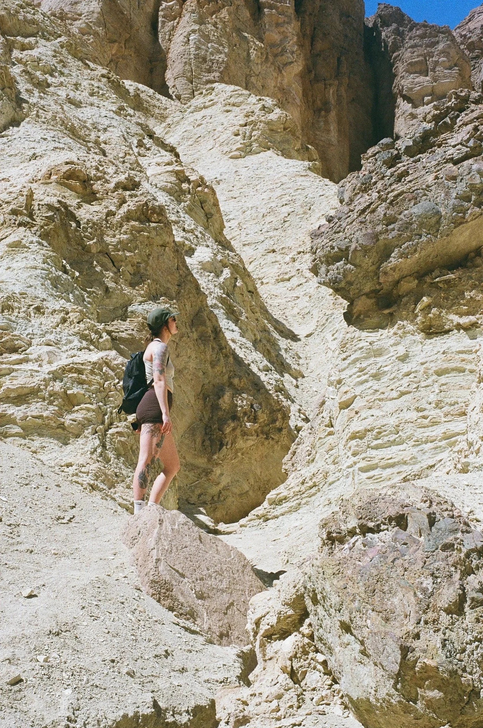 A Guelph OCD therapist in Alberta climbing on rocks on a hike