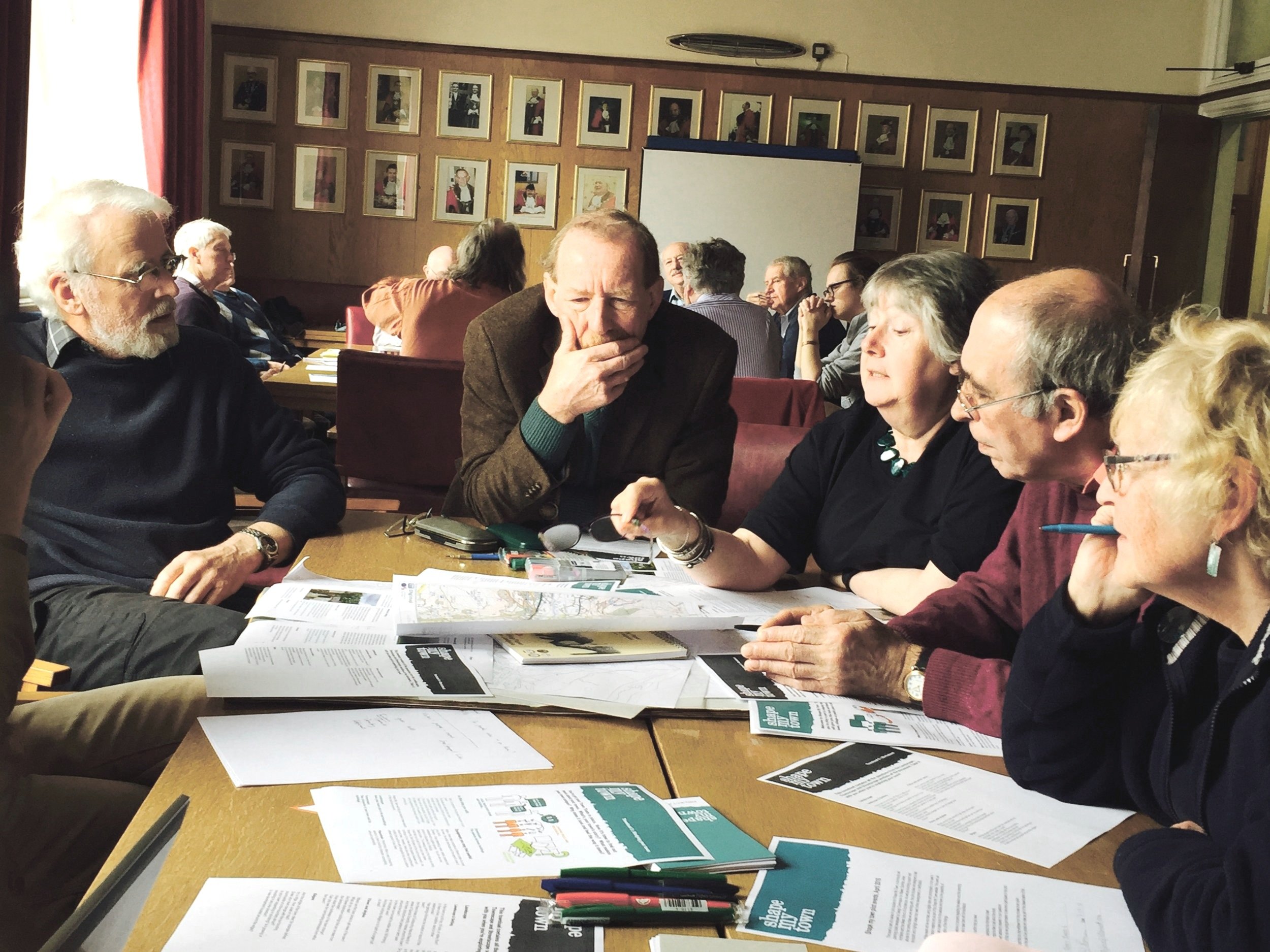 A group around a table in discussion