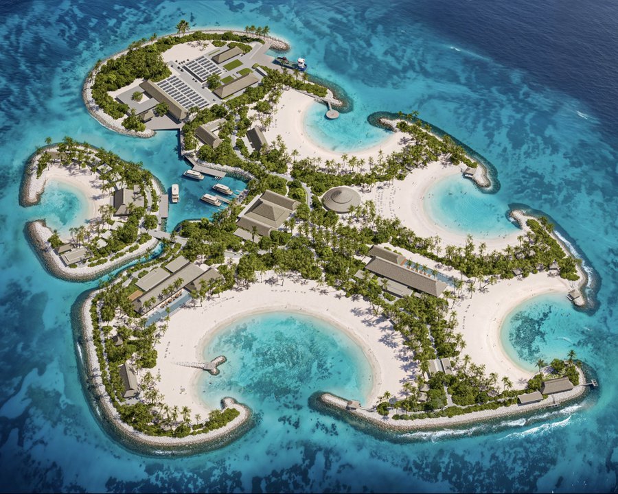 Rendering of a beach cove at MSC Sandy Cay with a round thatched dining pavilion, loungers on white sand and rock breakwaters
