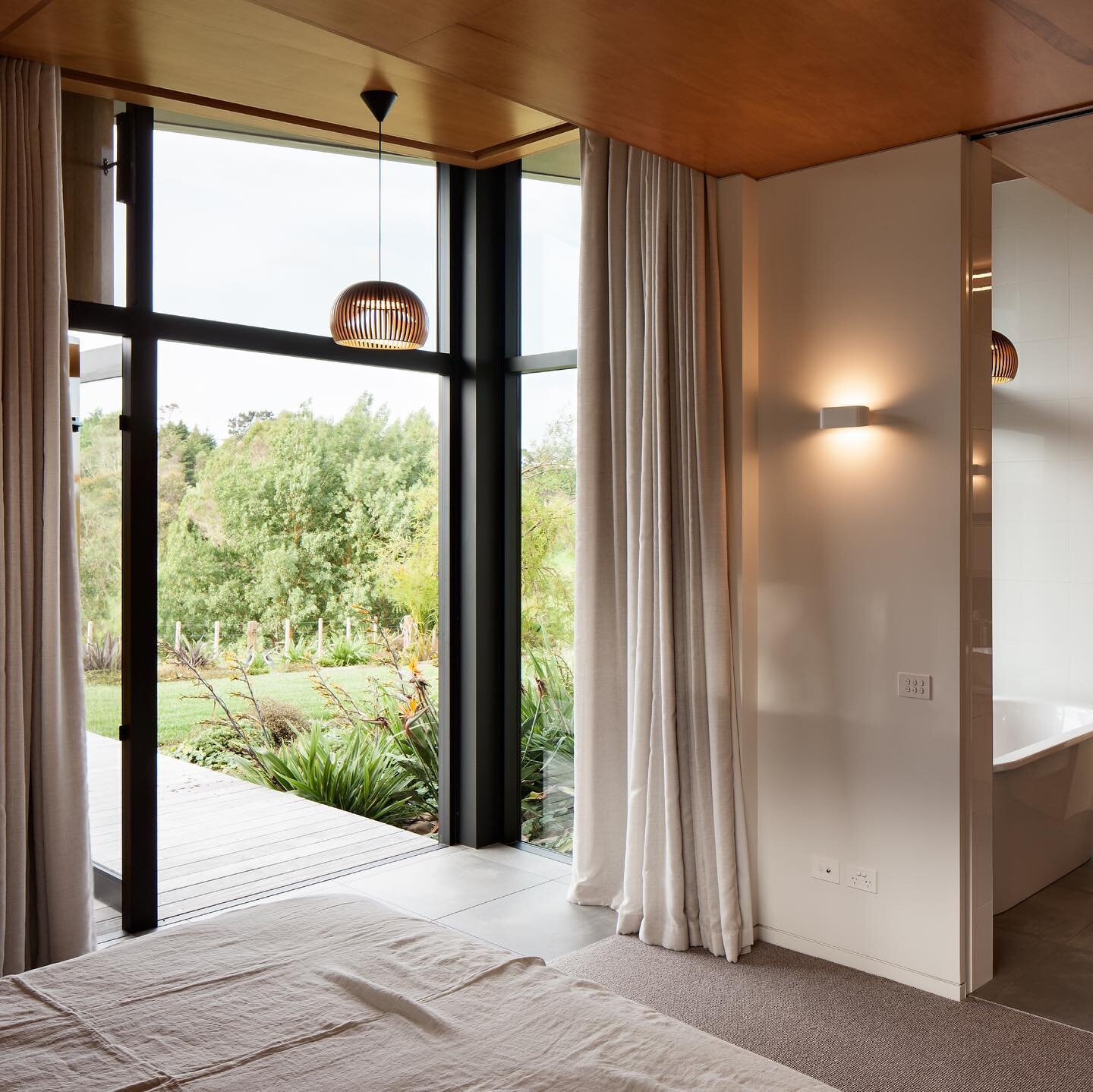 Te Hihi Home &mdash; Full height windows and recessed curtains perfectly framing the lush outlook.
