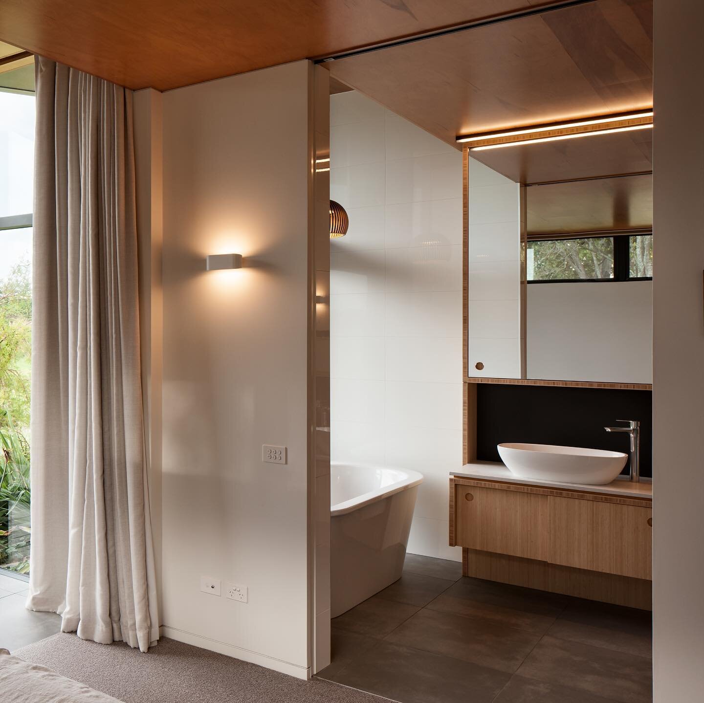 Te Hihi Home &mdash; custom made bamboo vanities integrating nicely with the Fijian Kauri plywood ceilings.