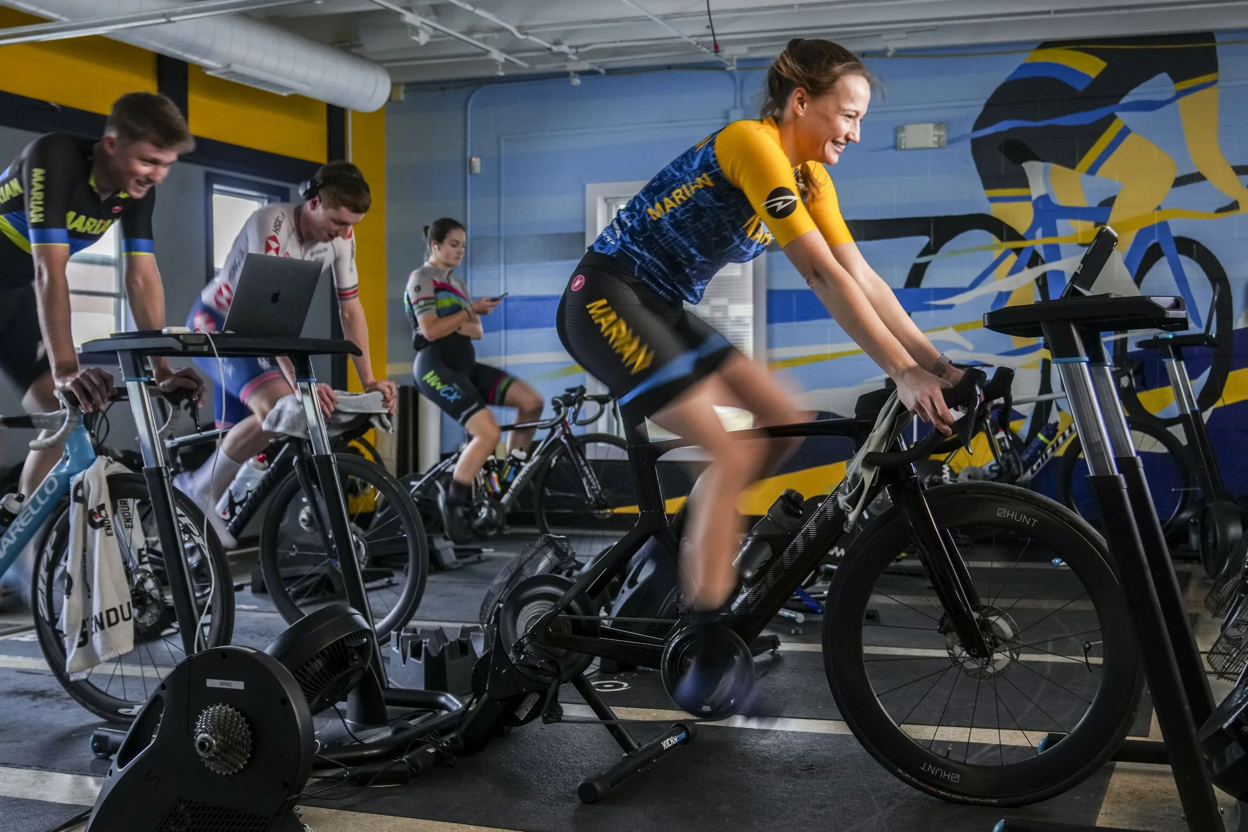 Stephanie Lawrence trains with her teammates in the cycling center at Marian University in Indianapolis, Ind., on Wednesday, Feb. 12, 2025. Lawrence attended a camp before Juniors Track Nationals in the summer of 2020 at the velodrome in Indianapolis