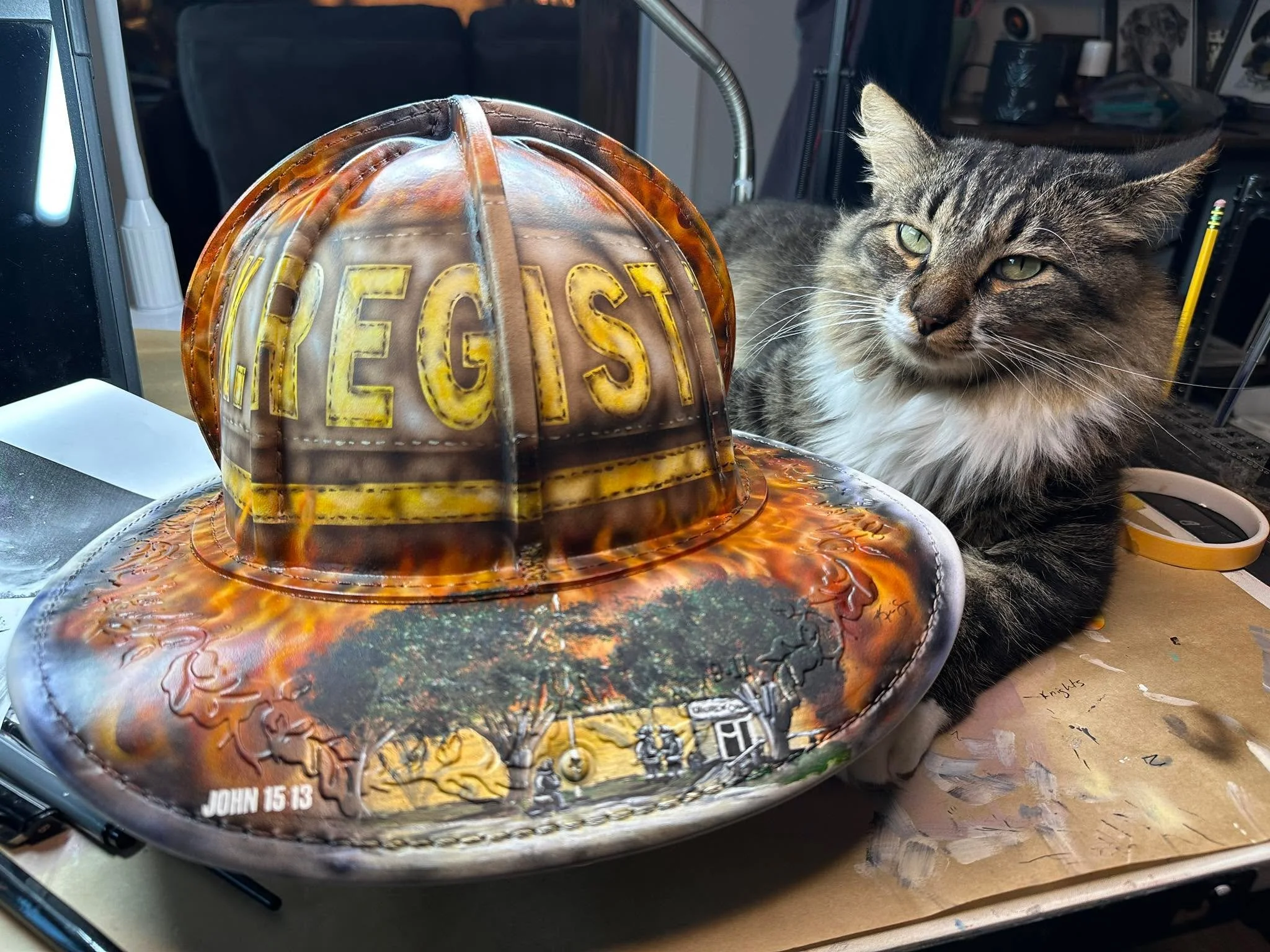 My assistant clearly isn&rsquo;t impressed with my progress on this fire helmet. Tough crowd. 😼🔥🎨

#StudioCat #CatAttitude #ArtistLife #FirefighterArt #CatSupervisor #JudgyCat