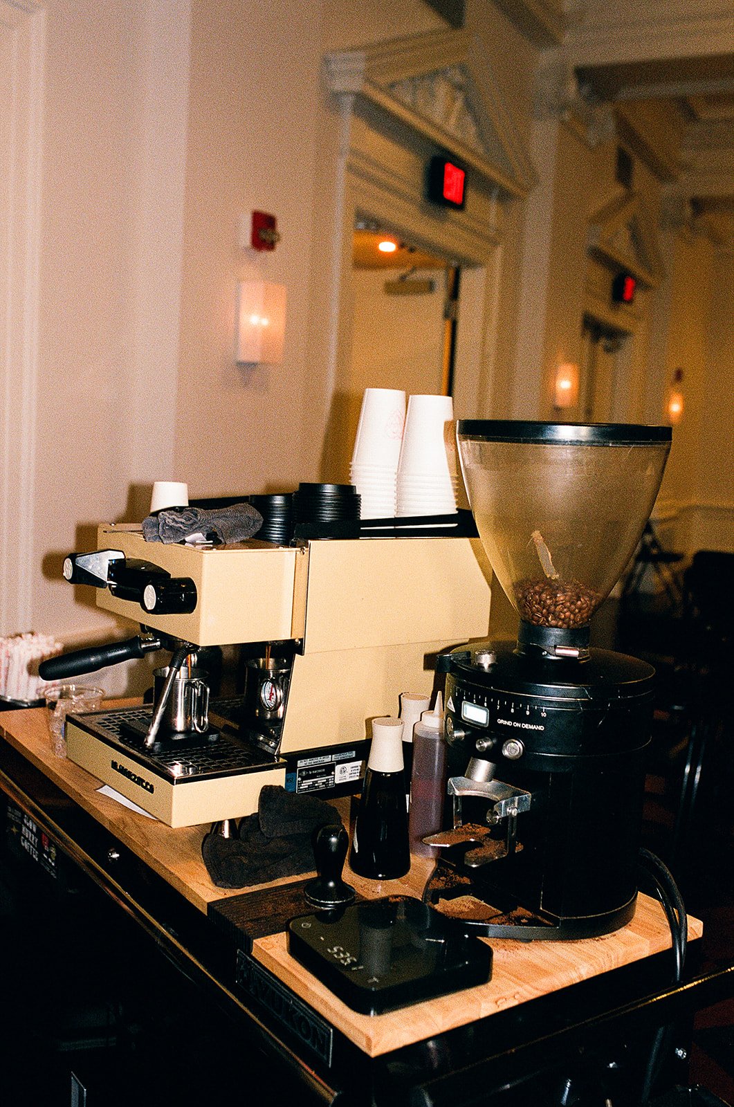 Film photo of a mobile espresso set up showing the espresso machine and the grinder.