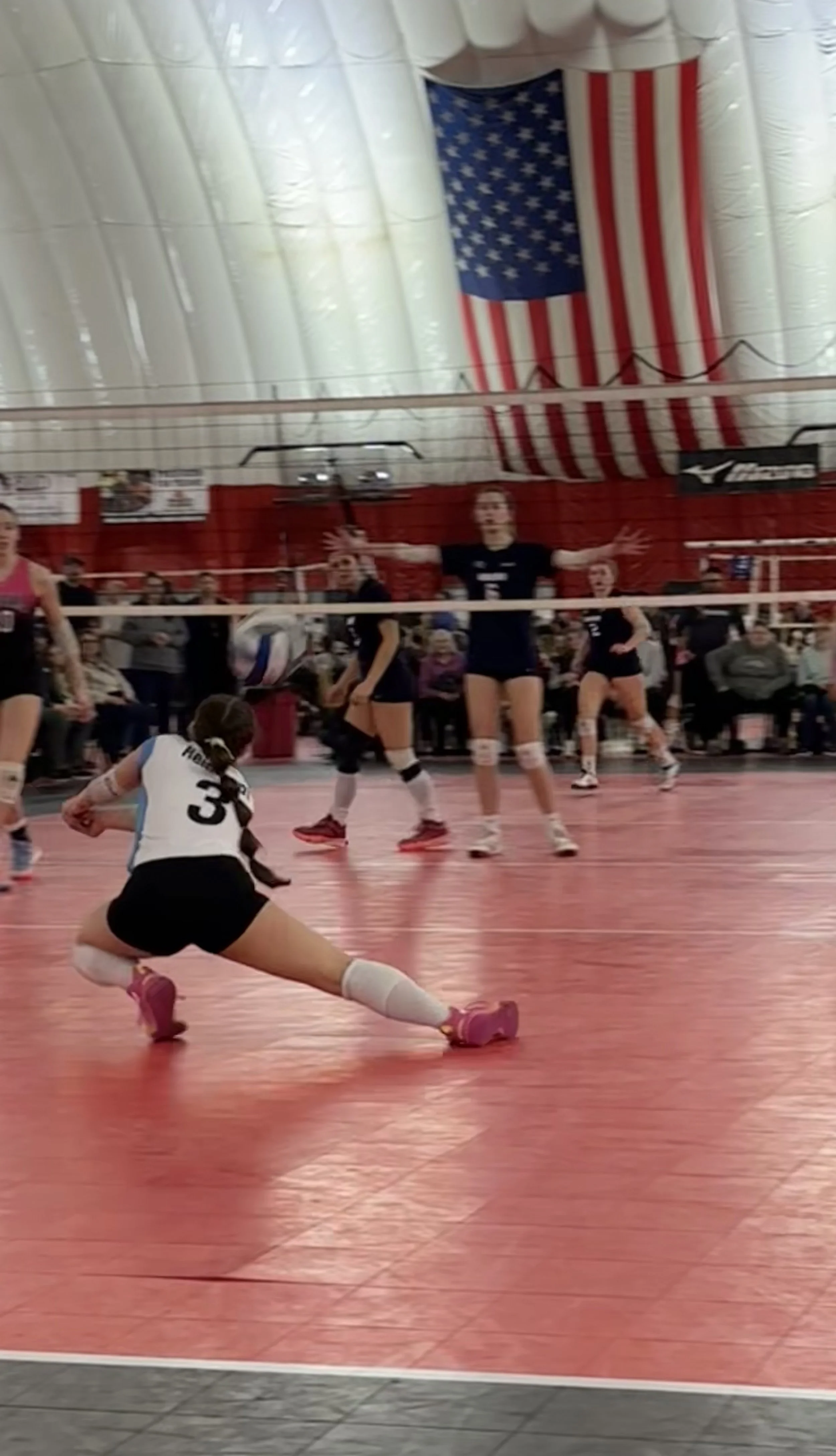 Maddie diggin a ball