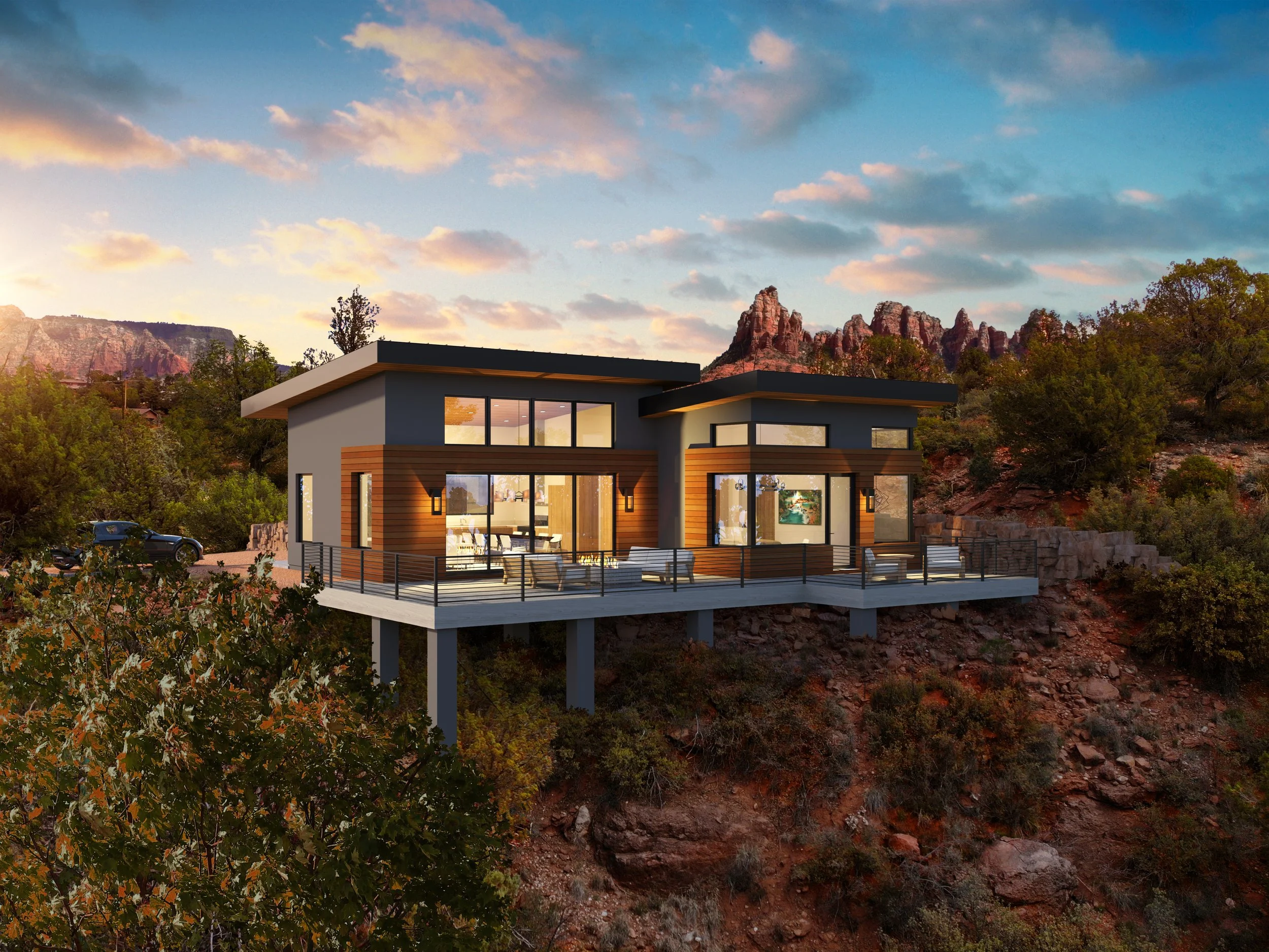 Modern house elevated on supports overlooking a mountainous landscape with trees and a partly cloudy sky. Modern luxury home in Sedona, AZ