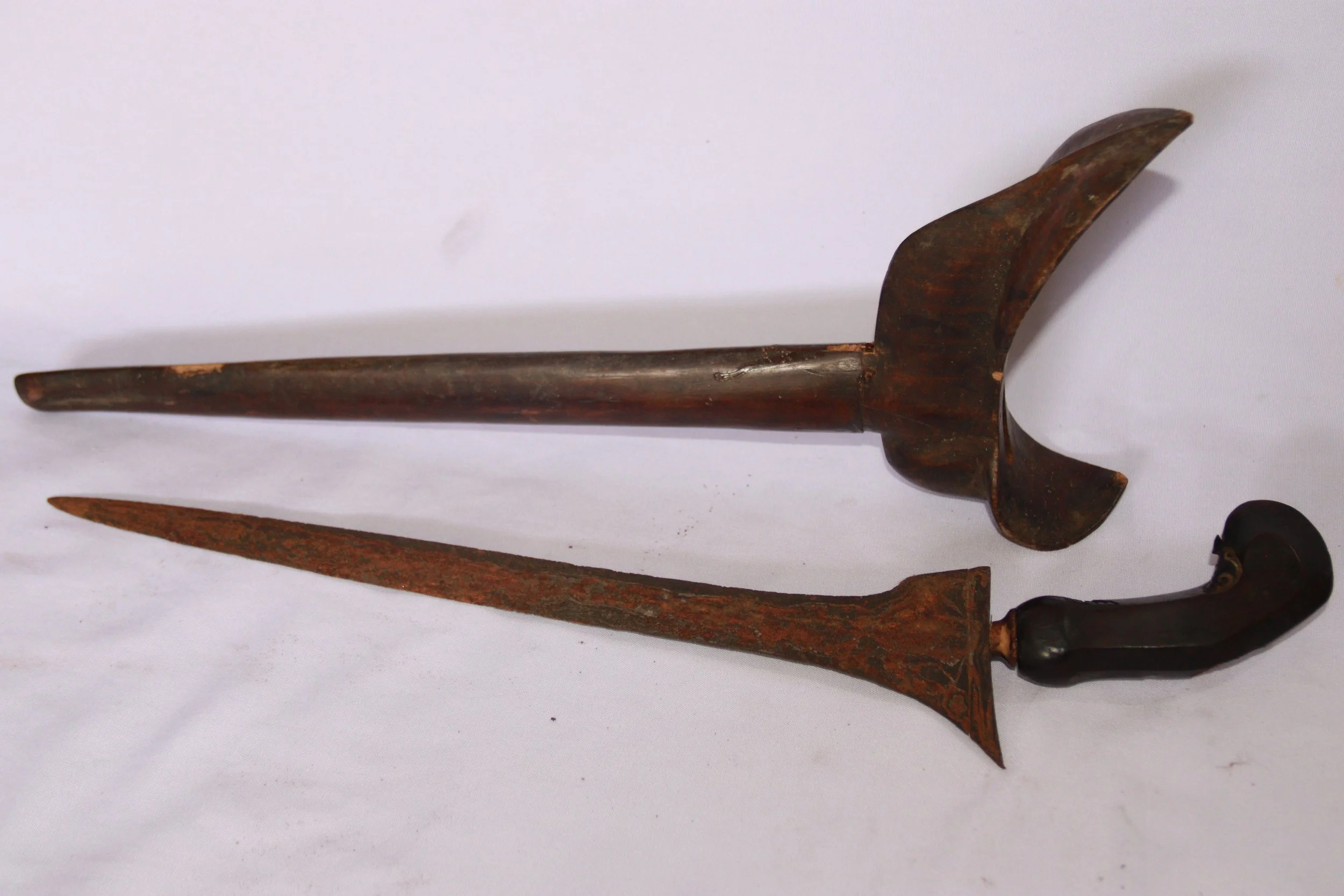 archive number: r-2-017
object reference: 
Keris Blade & Sheath
origin: -
date: -
notes: This artefact was likely brought to Banda by migrants during the colonial era, but they represent the type of craftsmanship that was often exchanged for spices b