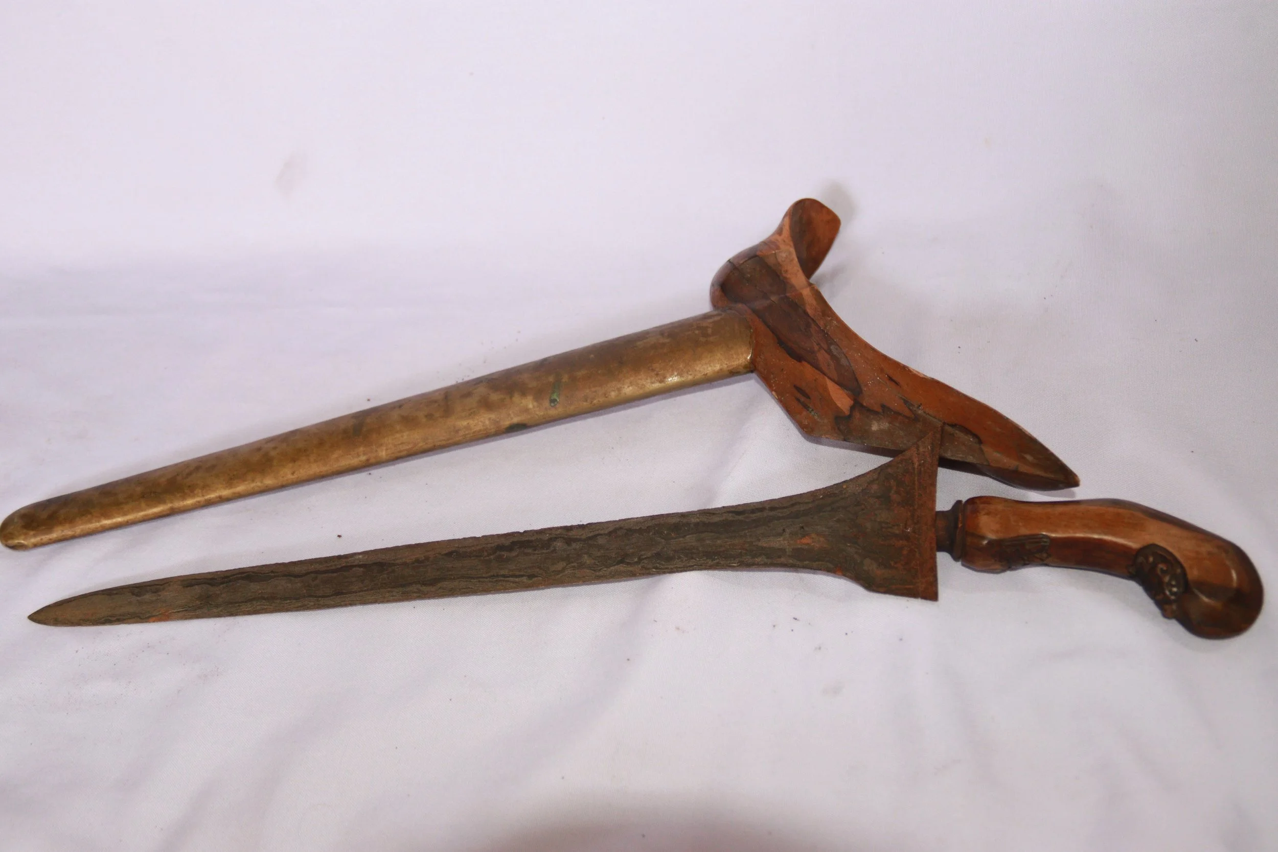 archive number: r-2-016
object reference: 
Keris Blade & Sheath
origin: -
date: -
notes: This artefact was likely brought to Banda by migrants during the colonial era, but they represent the type of craftsmanship that was often exchanged for spices b