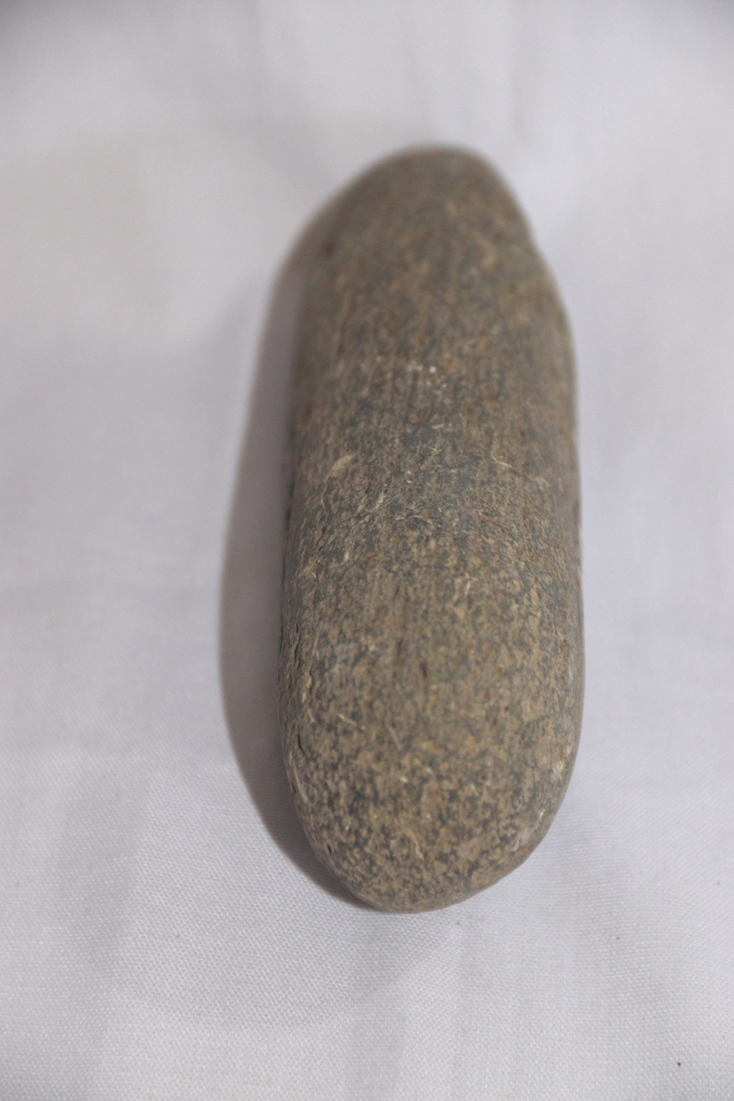 archive number: r-1-024
object reference: 
Prehistoric stone axe
origin: Banda
date: -
notes: A stone tool used to dig holes to plant crops and break wood by the ancient Bandanese.
