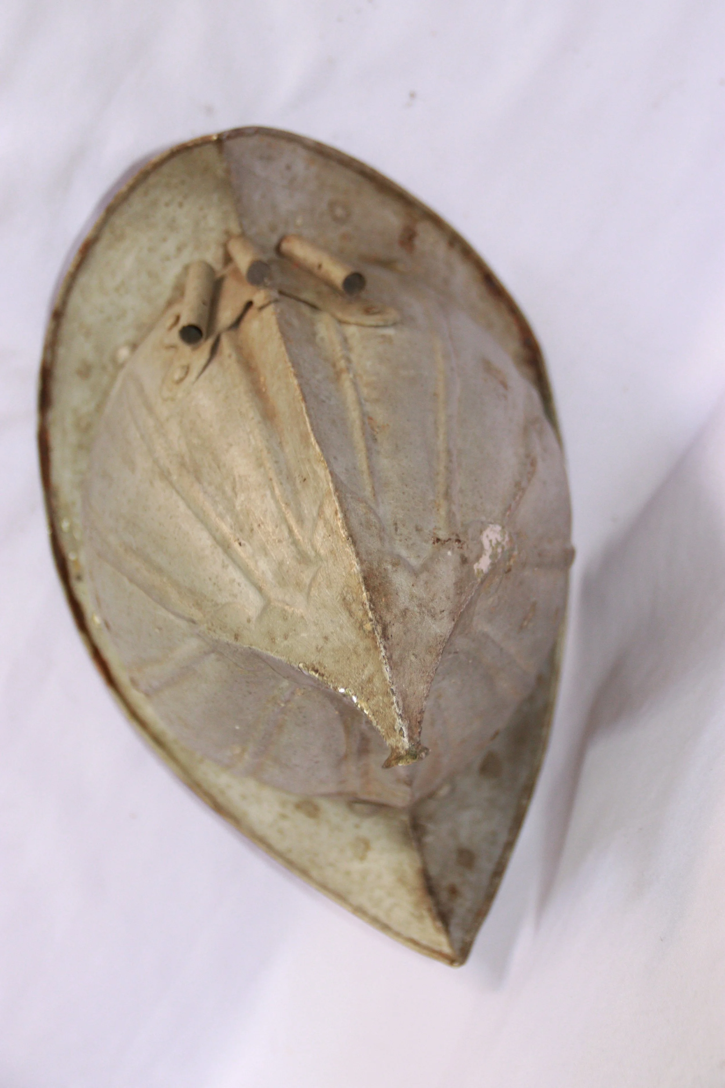 archive number: r-6-014
object reference: 
Bandanese Kapsete
origin: Banda
date: -
notes: Kapsete are traditional helments and a central component of Banda's customary attire. They originate in early interactions with Portuguese expeditions, but now 