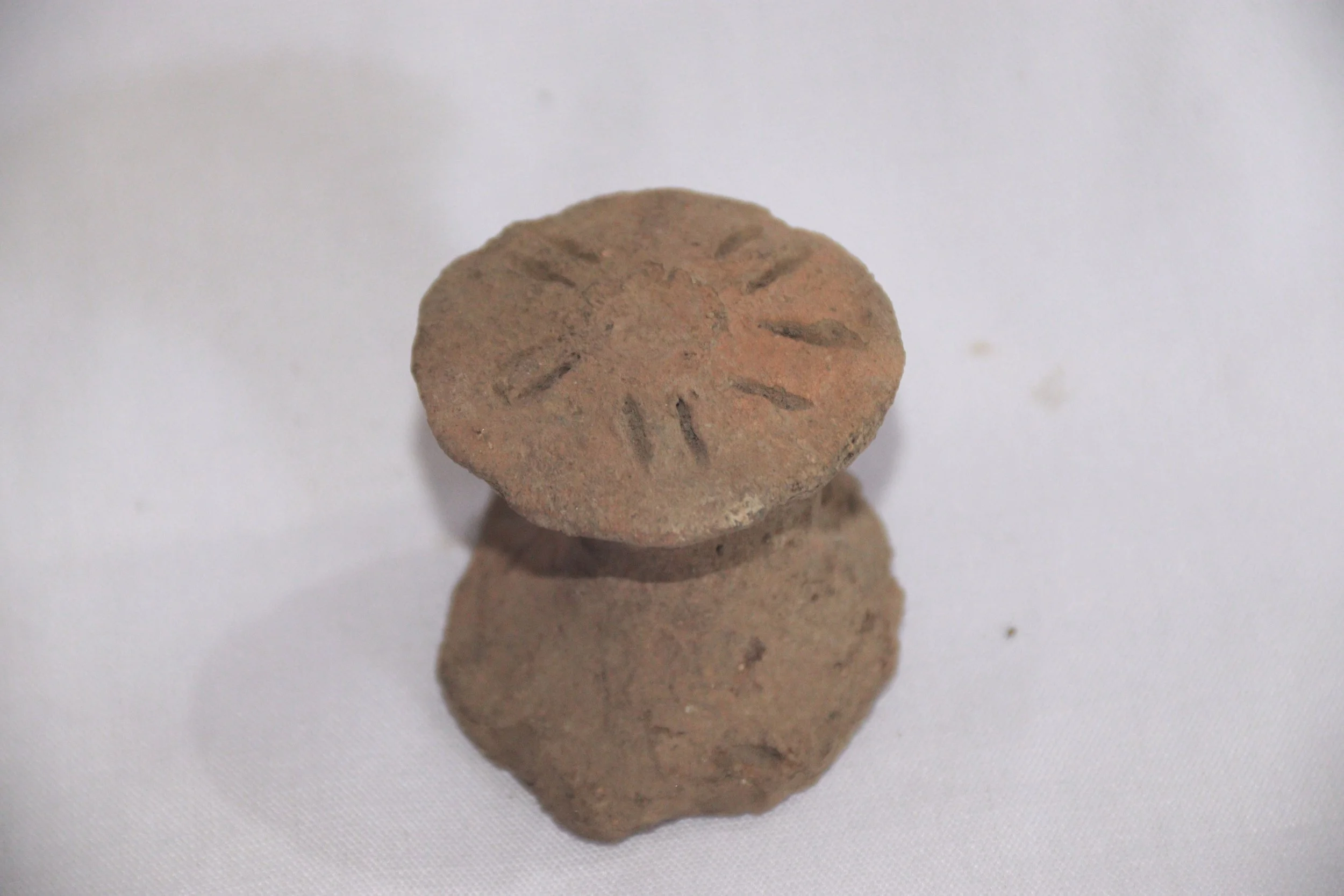 archive number: r-1-022e
object reference: 
Pottery fragments
origin: Banda
date: -
notes: Many of these pottery pieces are shaped like bird heads and ears, usually used as handles on clay vessels. On the pottery fragments we can see decorative patte