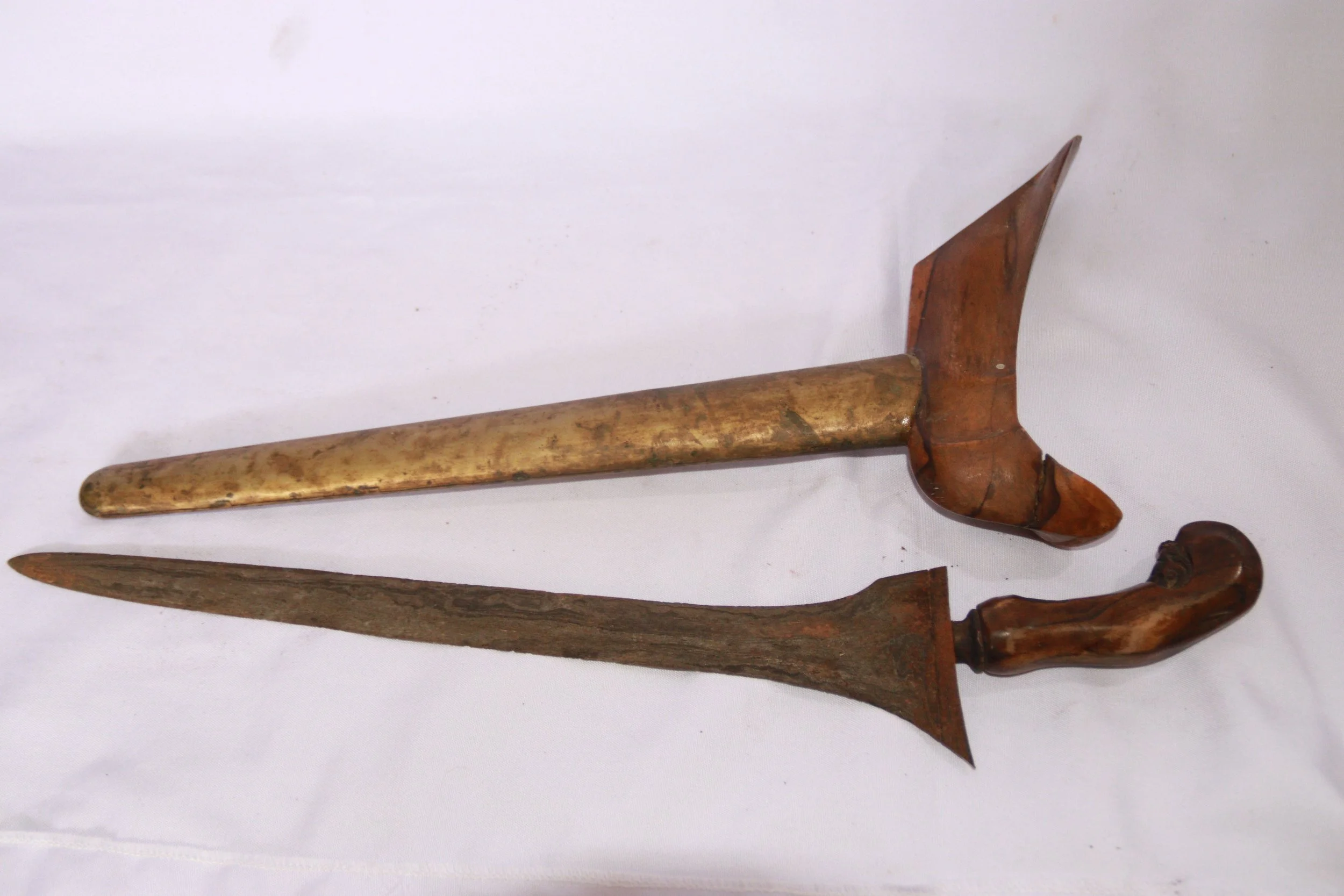 archive number: r-2-016
object reference: 
Keris Blade & Sheath
origin: -
date: -
notes: This artefact was likely brought to Banda by migrants during the colonial era, but they represent the type of craftsmanship that was often exchanged for spices b