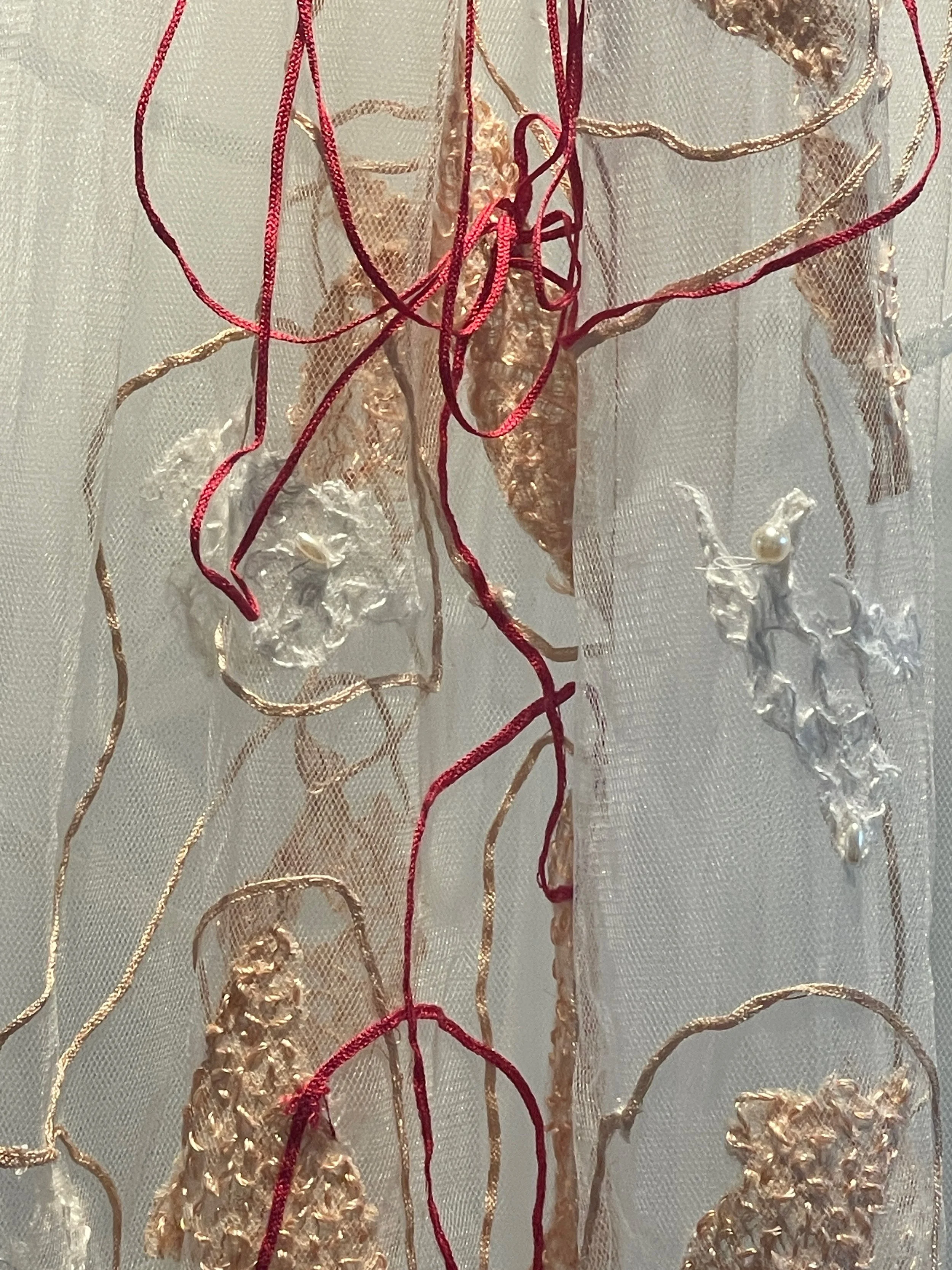 White wedding... a departure from what has gone before (detail), 2026, Improvisational embroidery and appliquéd mulberry bark on discarded net veil. Photography Joy Denise Scott