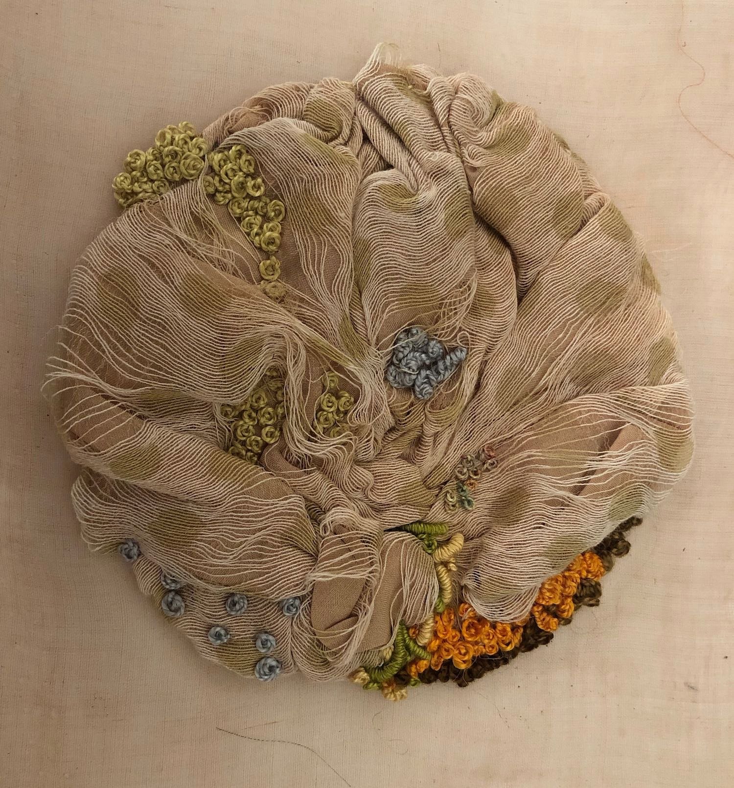 Echoes of things past, 2022. Embroidery and fabric manipulation on eco dyed recycled muslin shawl and cotton organdie. 210mm x 170mm. Photograph Joy Denise Scott.