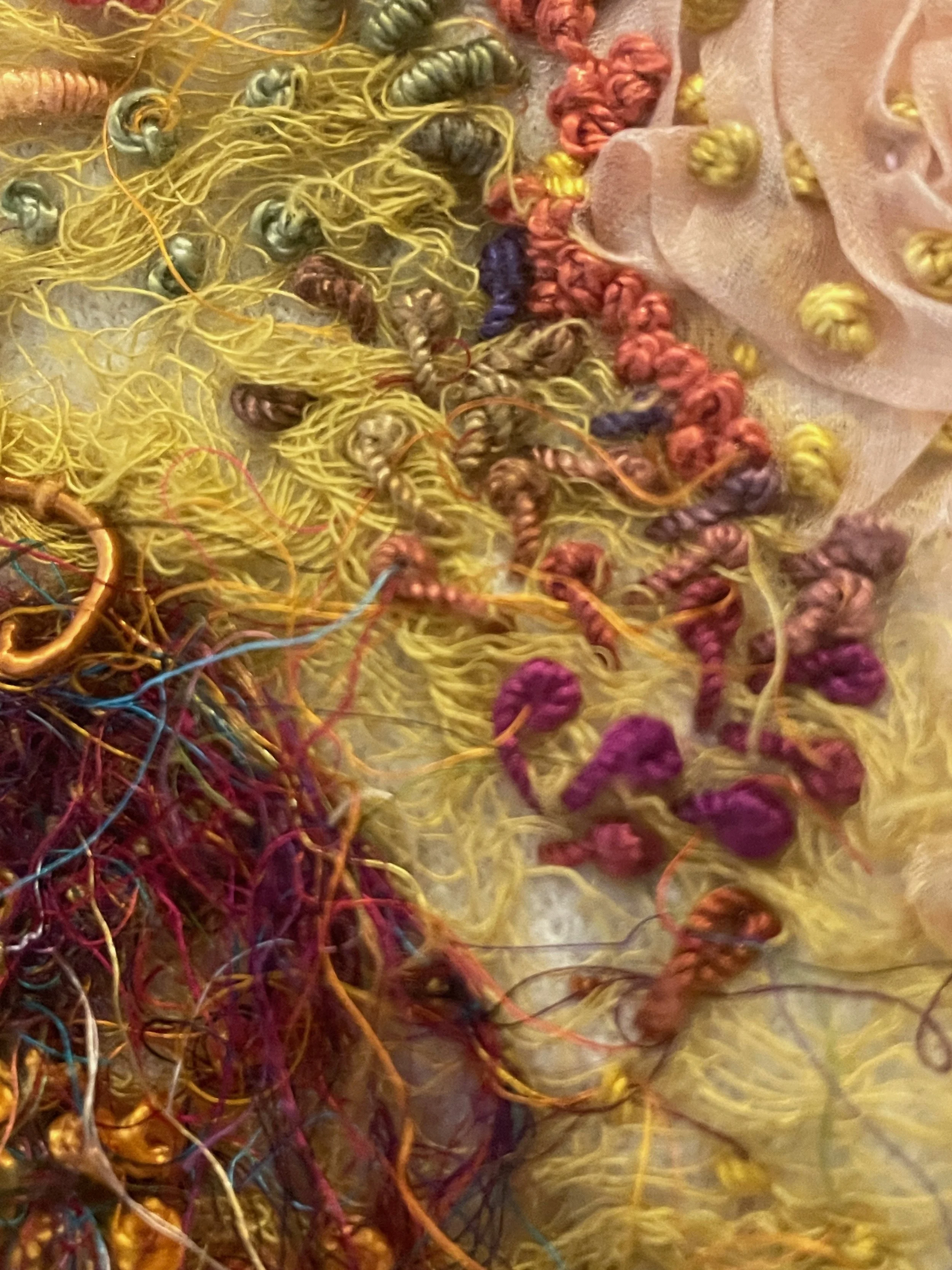 Shrunk, (detail) 2025. Artist's discarded shrunken felted wool cardigan, silk scraps, silk fibre, recycled sari silk thread, cotton and silk scrim, gimp, mulberry bark and assorted silk and cotton embroidery threads. Photography Joy Denise Scott.