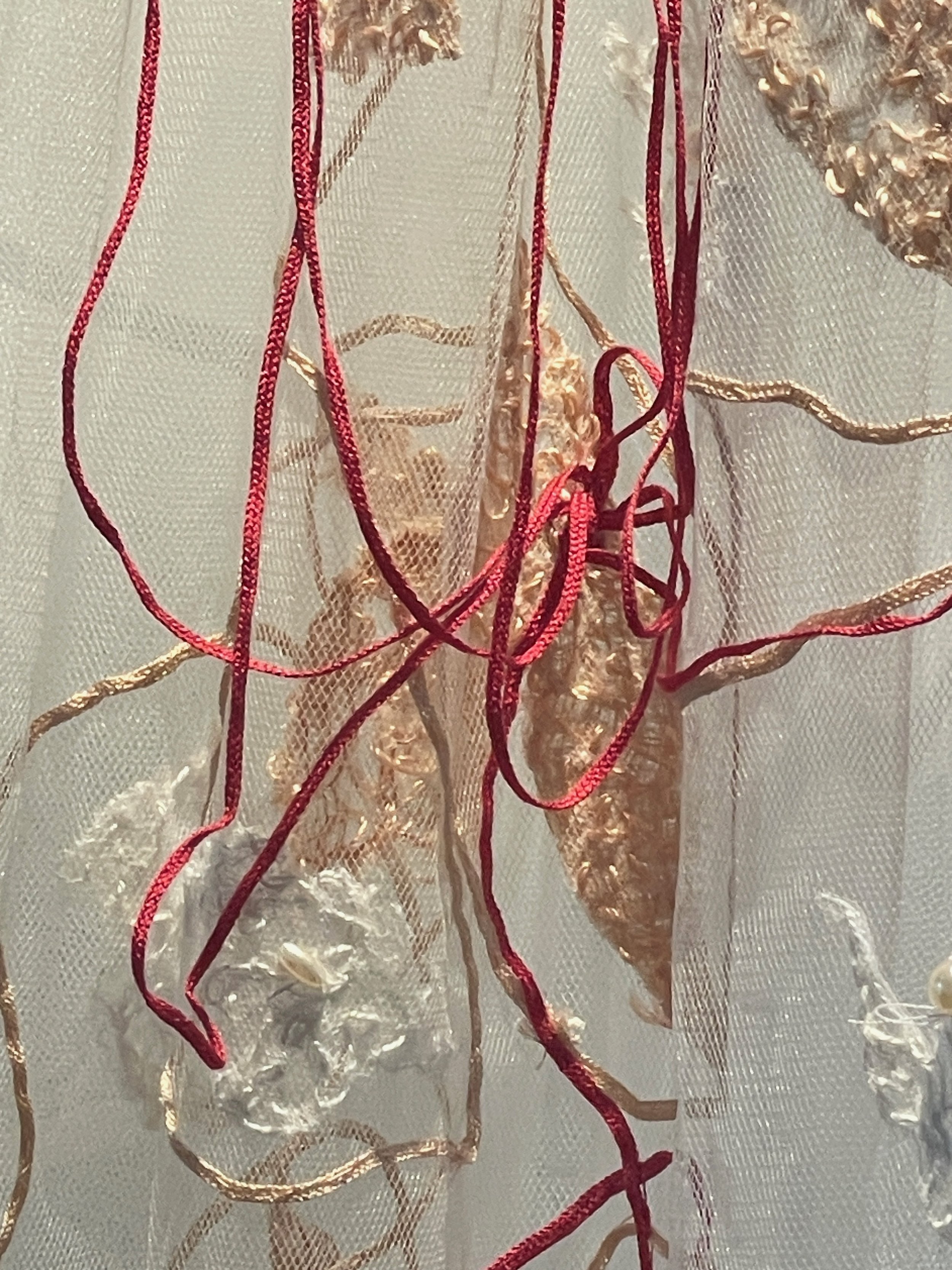 White wedding... a departure from what has gone before (detail), 2026, Improvisational embroidery and appliquéd mulberry bark on discarded net veil. Photography Joy Denise Scott